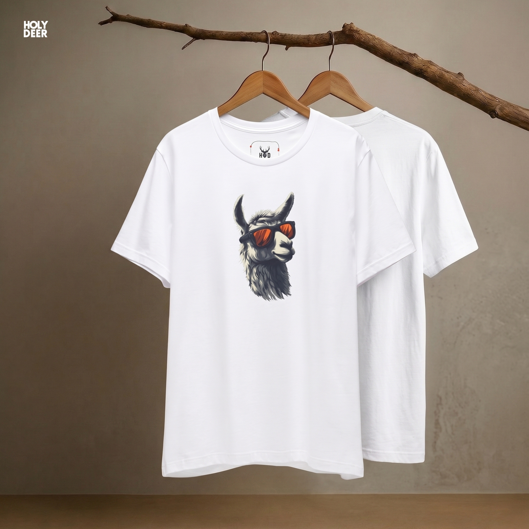 Macro view of the intense orange sunglasses frames embedded in the Cool Llama Shirt artwork, showing the line-art depth that separates this holydeer tee from generic products.