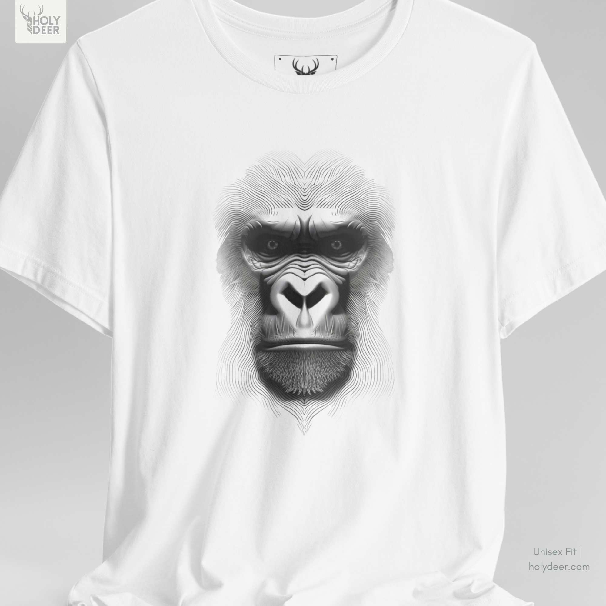 Professional flat lay photography of the Gorilla Graphic Tee by Holydeer Apparel, arranged cleanly next to polished black obsidian stones, heavy raw iron chains, and premium lifestyle aesthetic ape shirt items.