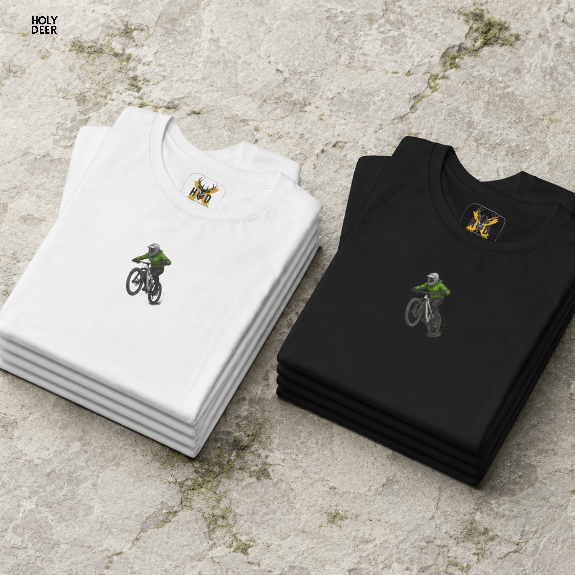 High-magnification print detail tracking the smooth green ink jacket coating, black sleeve creases, and helmet visor curves forming the body of the MTB graphic tee.