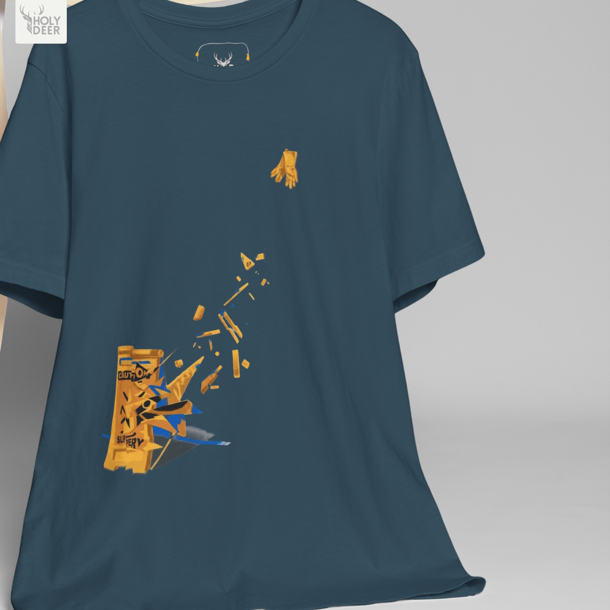 The iconic Caution Sign Tee hanging cleanly on a luxury wood hanger, highlighting the robust neckline structure, slippery when wet graphic flow, and the official holydeer.com retail tags.