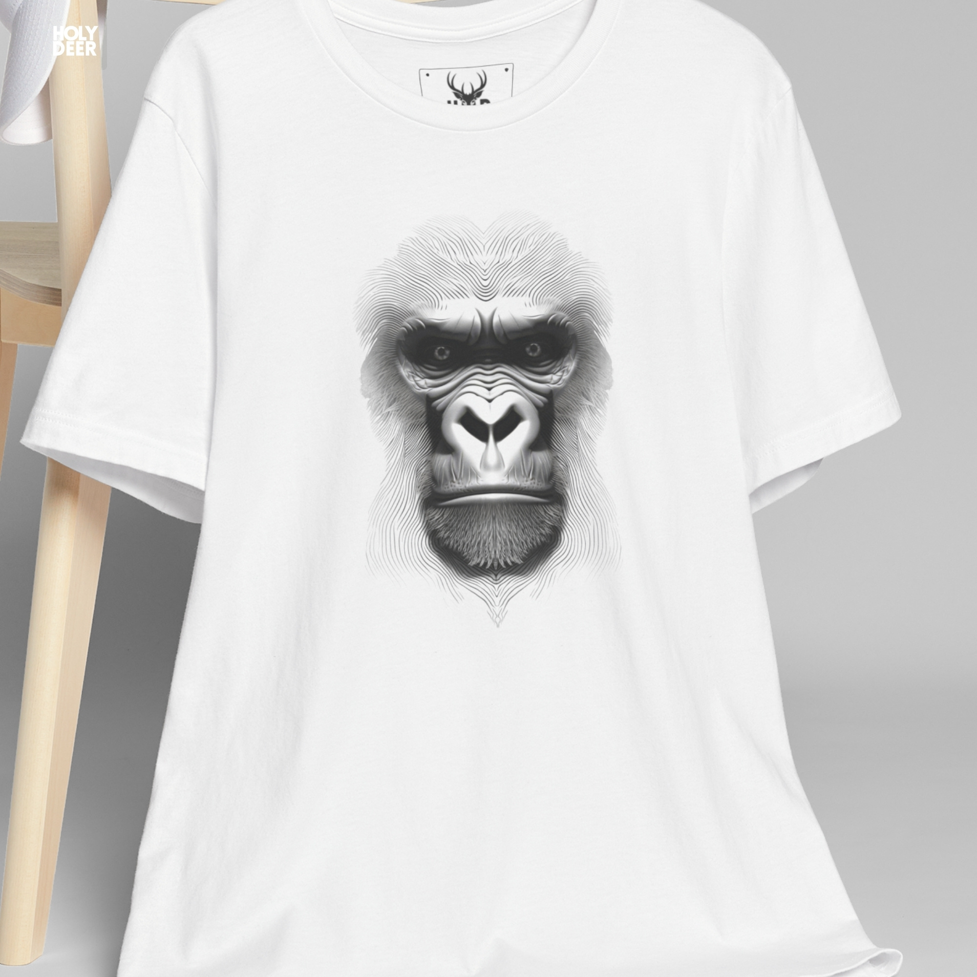 Modern brutalist industrial concrete architecture outdoor lifestyle model wearing the centered Gorilla Graphic Tee from Holydeer Clothing, standing as an edgy streetwear top statement matching elite abstract wildlife trends.