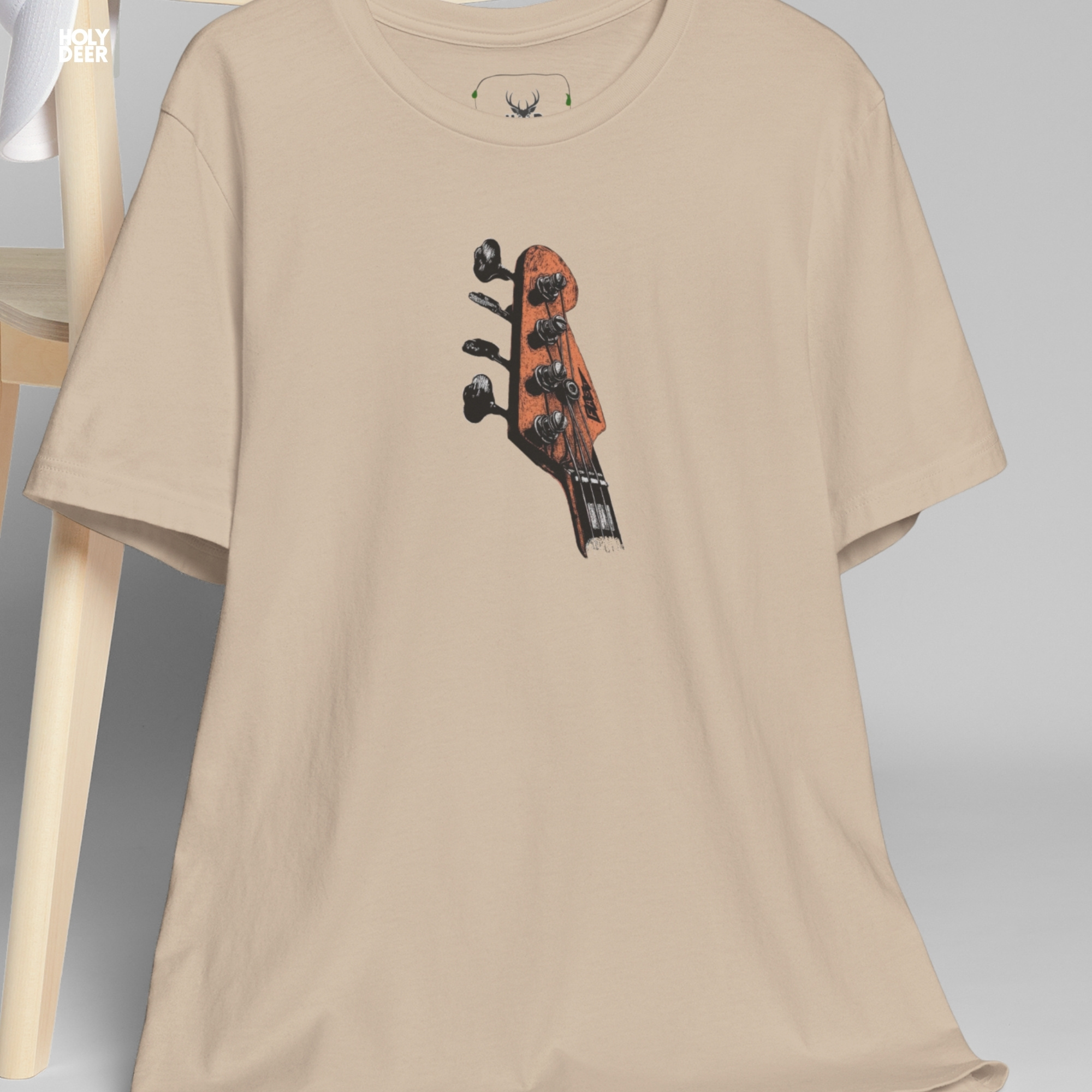Urban model styling the oversized Bass Guitar Tee from Holydeer Clothing, standing as a high-end musician gift shirt alternative matching the finest modern classic rock wear aesthetics.