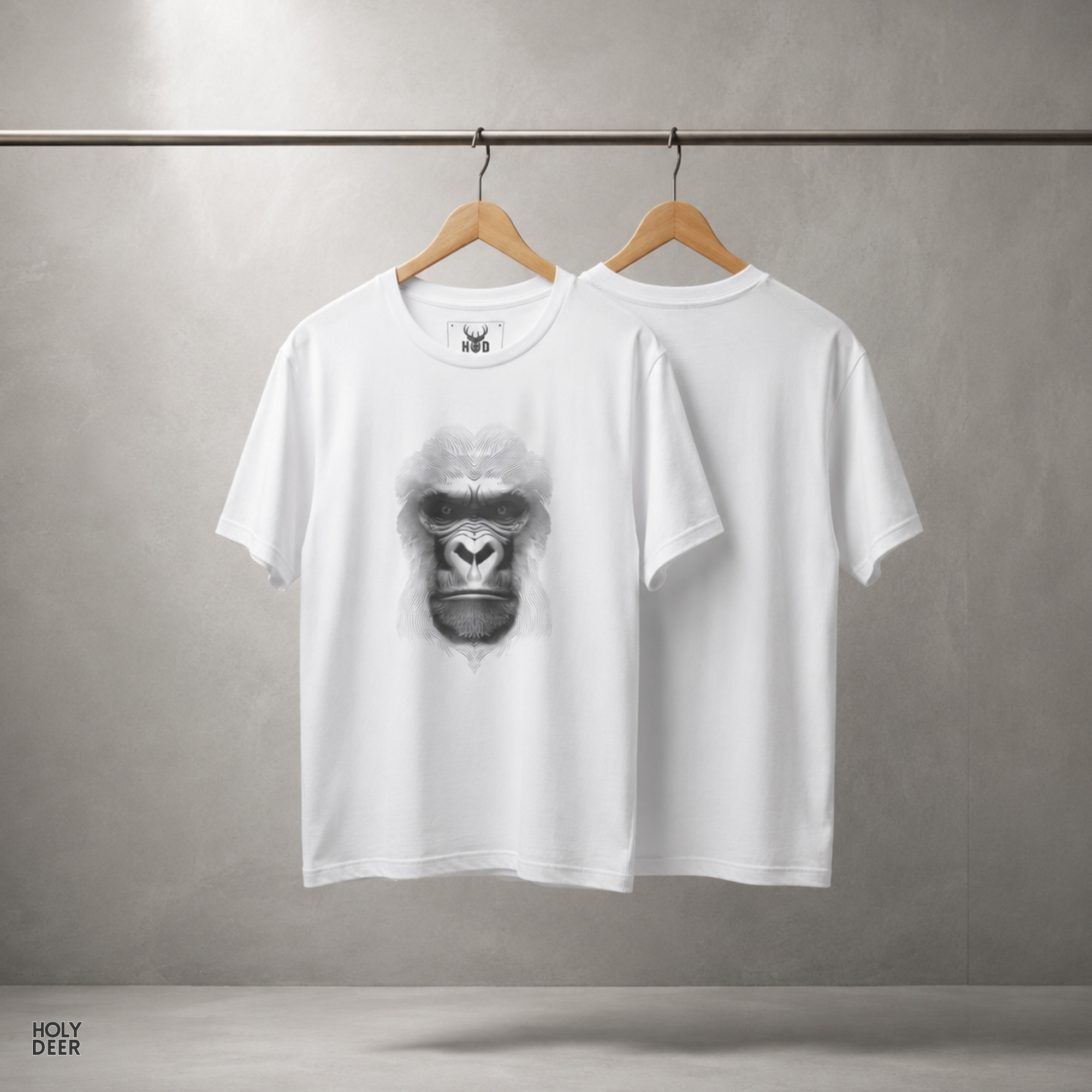 Soft dramatic matte grey studio ray backdrop framing the unique Gorilla Graphic Tee by Holydeer Streetwear, magnifying the clean centered optical illusion art placement and premium silverback apparel presentation.
