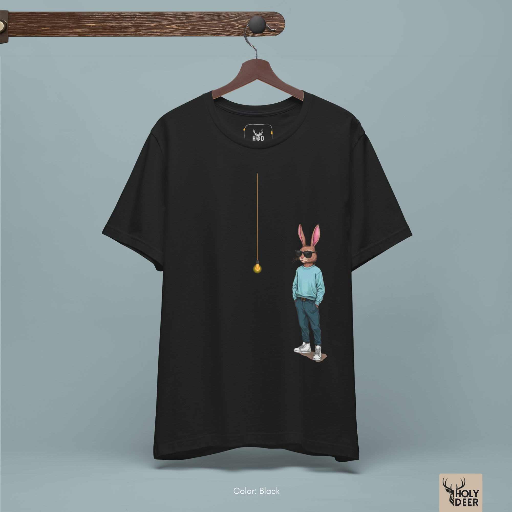 A candid industrial underpass outdoor lifestyle photo featuring a designer wearing the official Cool Rabbit Shirt by Holydeer Clothing, blending seamlessly into raw quirky streetwear and dynamic creative mind wear settings.