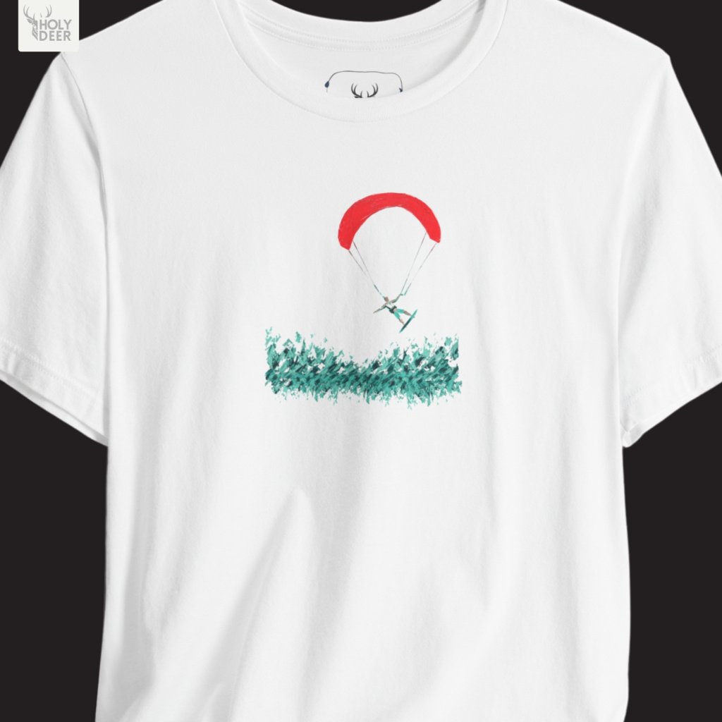 High-magnification print detail tracking the smooth red ink overlay, fine suspension lines, and curved aerodynamic canopy forming the parachute of the paragliding tee.