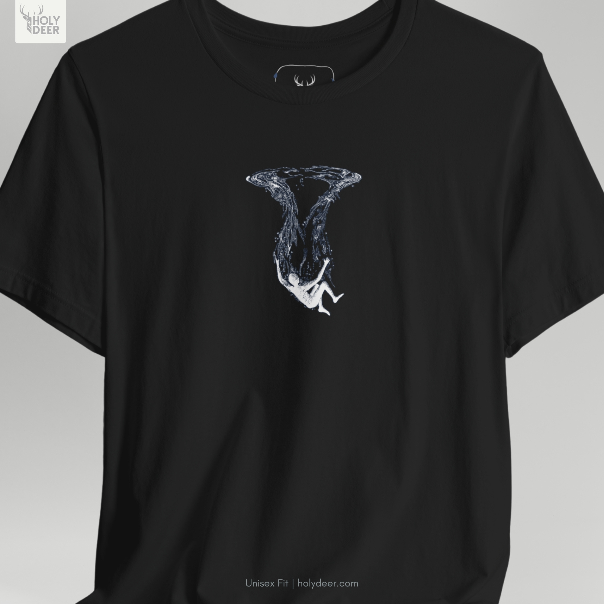 Commercial studio catalog frame of the independent teal graphic tee piece hanging elegantly under focused spot lights to capture accurate fabric drape.
