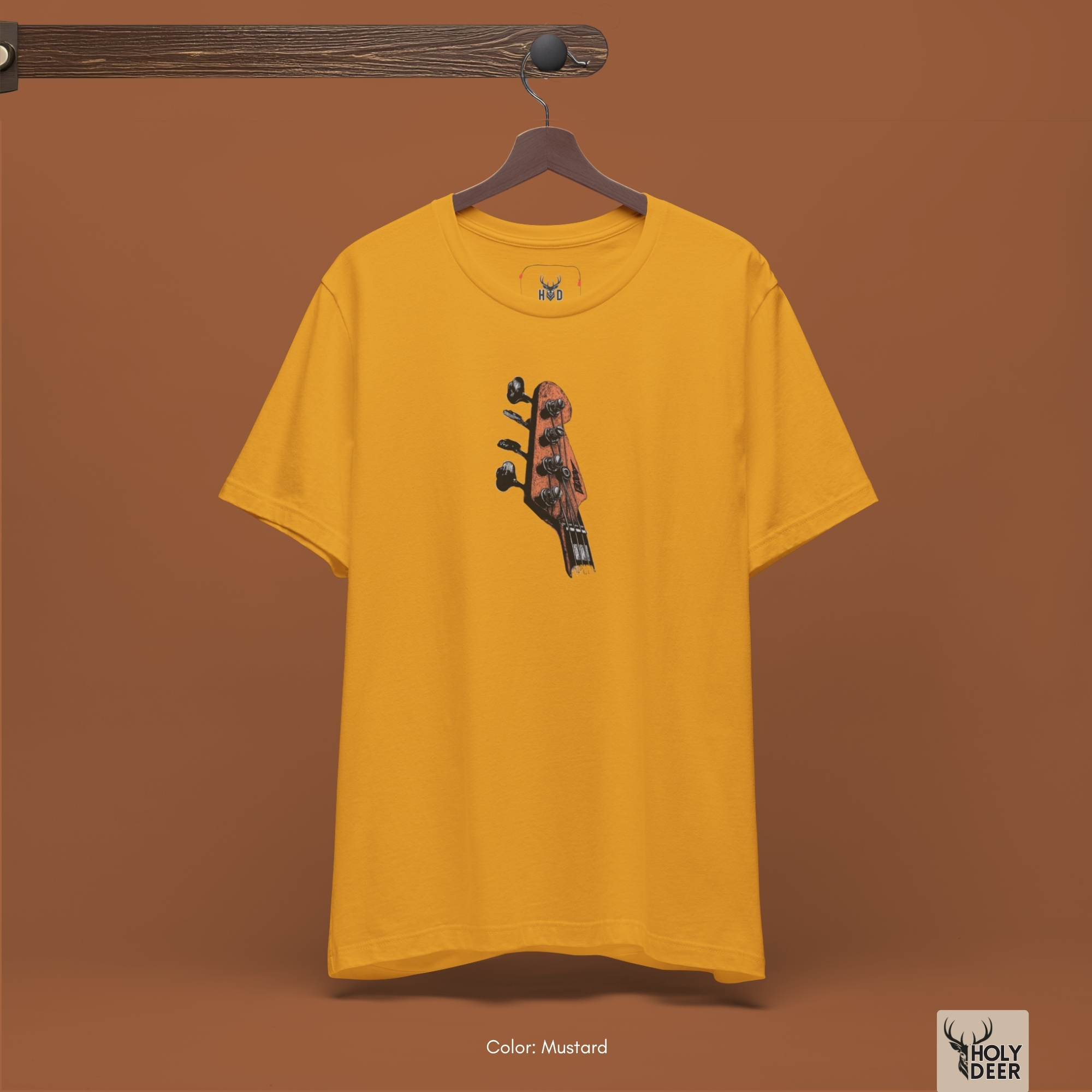 Macro view of the aged tuning keys embedded in the Bass Guitar Tee artwork, showing the line-art depth that separates this holydeer tee from mass-market garments.