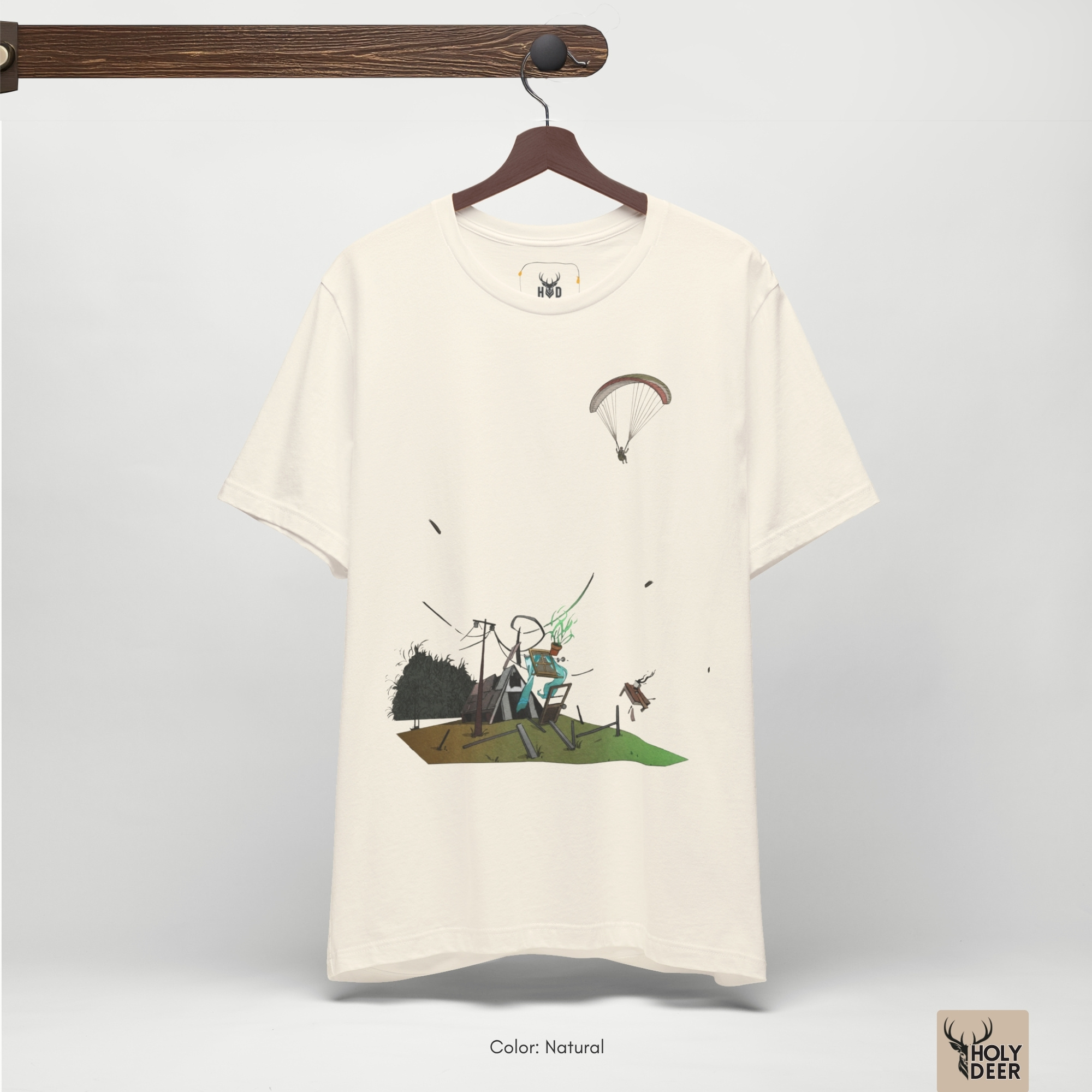Minimalist cream backdrop focusing heavily on the standalone silhouette of the Paragliding Tee by Holydeer, proving it acts as a unique artist gift and an essential extreme sport top piece.