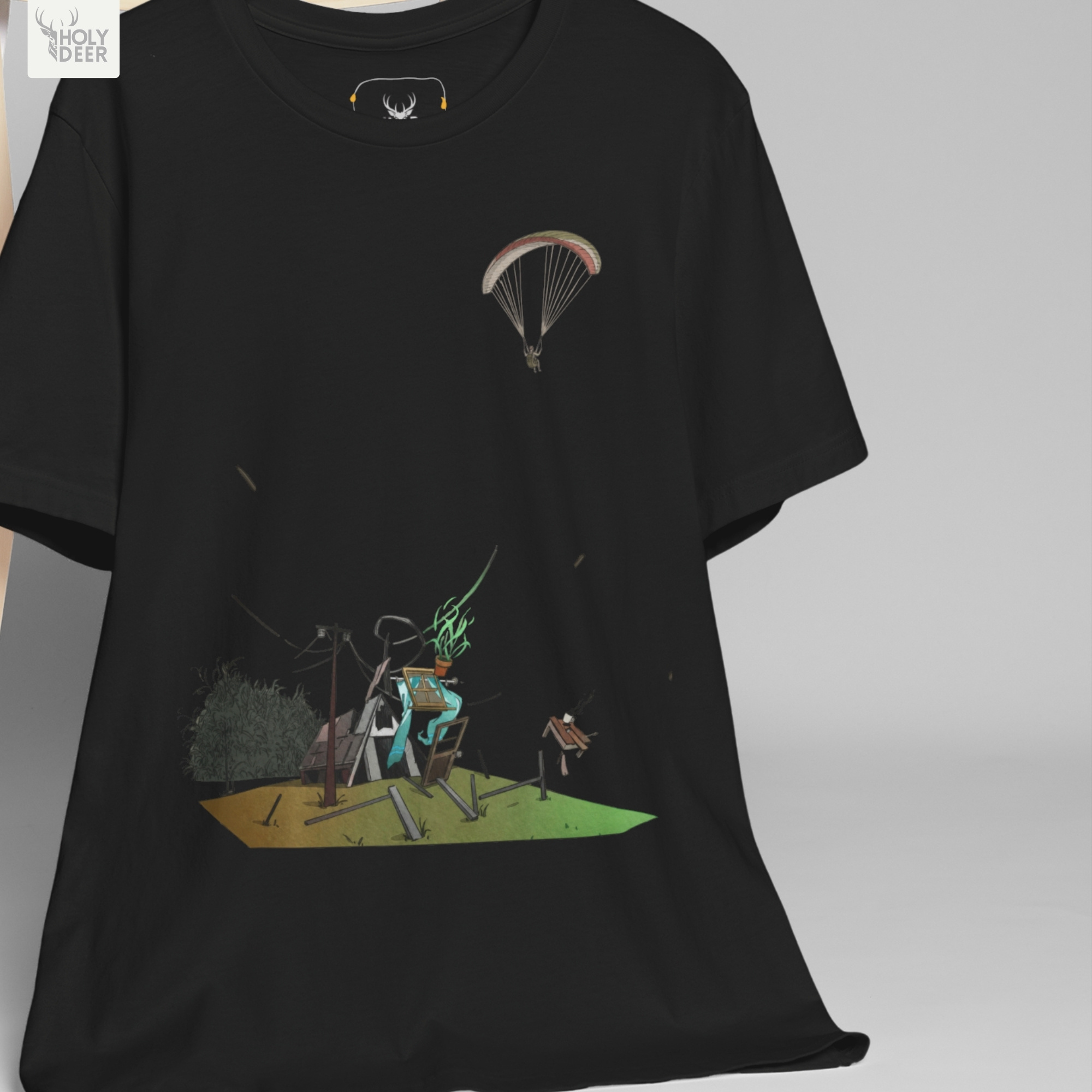 Professional flat lay photography of the Paragliding Tee by Holydeer Apparel, arranged elegantly next to premium sky adventure art blueprints and high-end storm chaser shirt accessories.