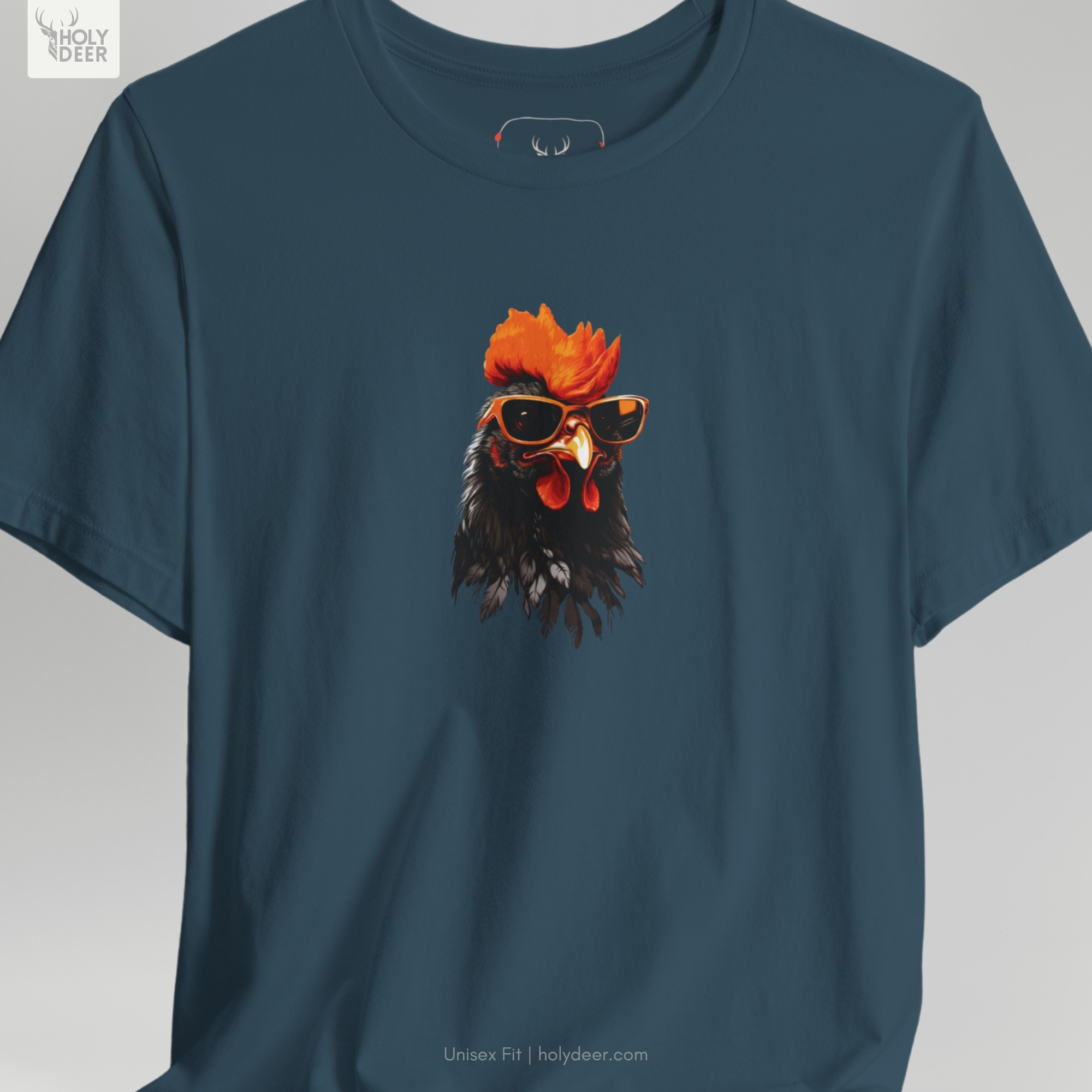 Professional flat lay photography of the Cool Rooster Tee by Holydeer Apparel, arranged elegantly next to premium creative artist wear accessories and high-end unique artist gift sketchbooks.