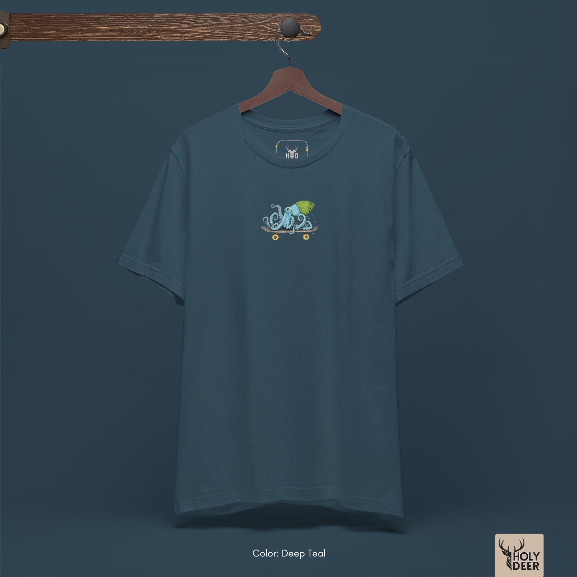 Dark shadow studio backdrop framing the unique Skater Octopus tee by Holydeer Streetwear, magnifying the clean centered graphic placement and premium skateboard shirt presentation.