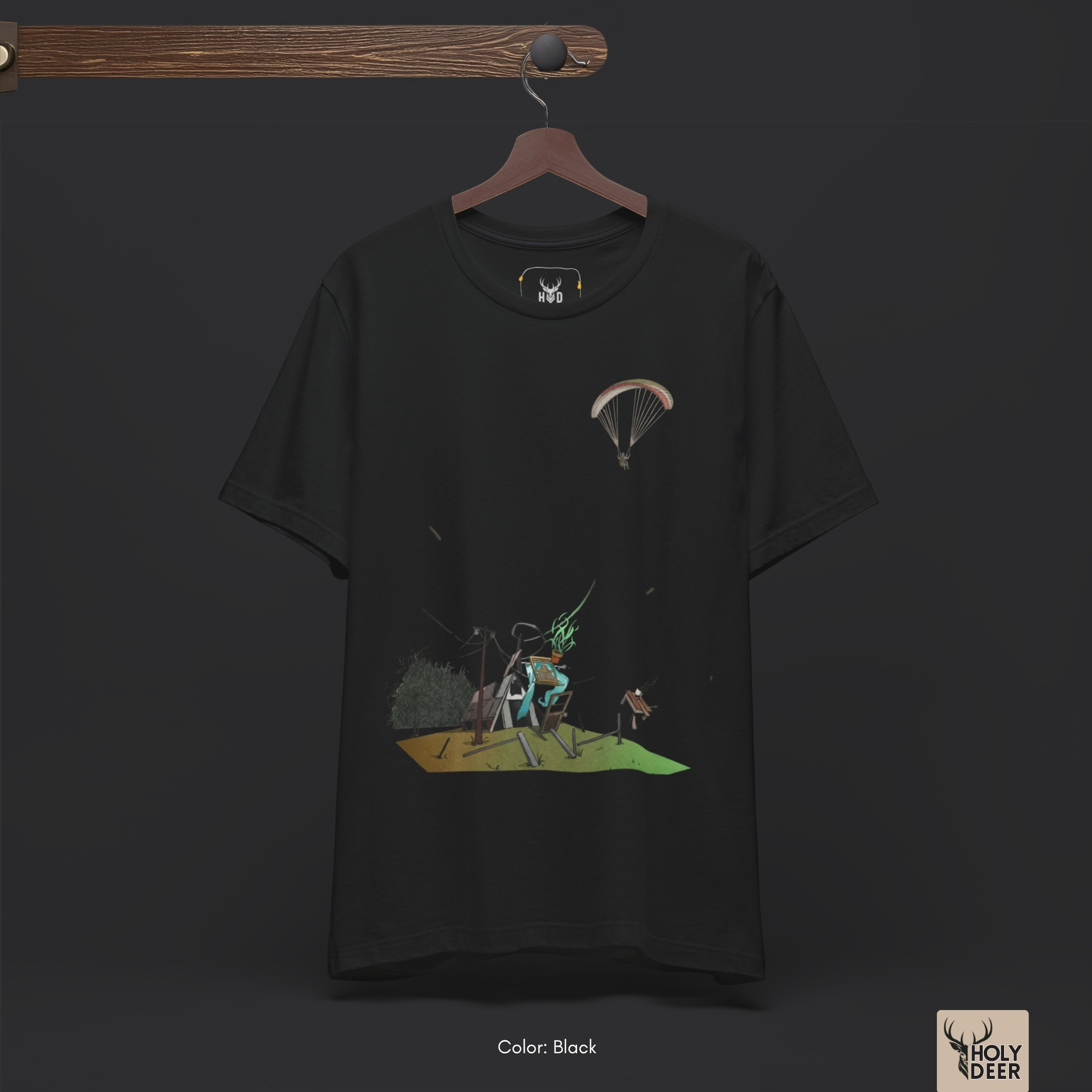 Dark shadow studio backdrop framing the unique Paragliding Tee by Holydeer Streetwear, magnifying the clean centered graphic placement and premium sky adventure art presentation.