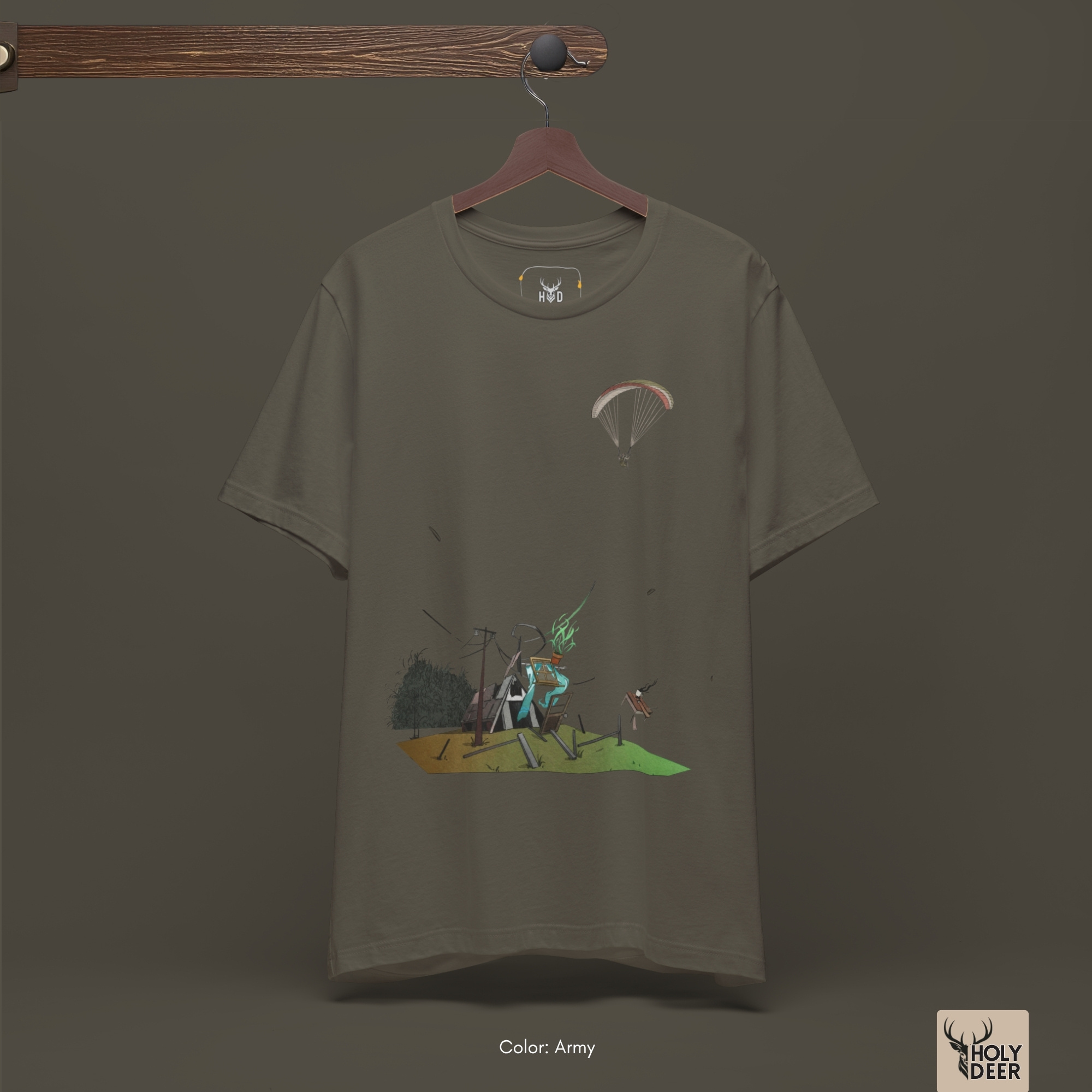 Macro view of the tiny flying paraglider silhouette embedded in the Paragliding Tee artwork, showing the line-art depth that separates this holydeer tee from generic garments.