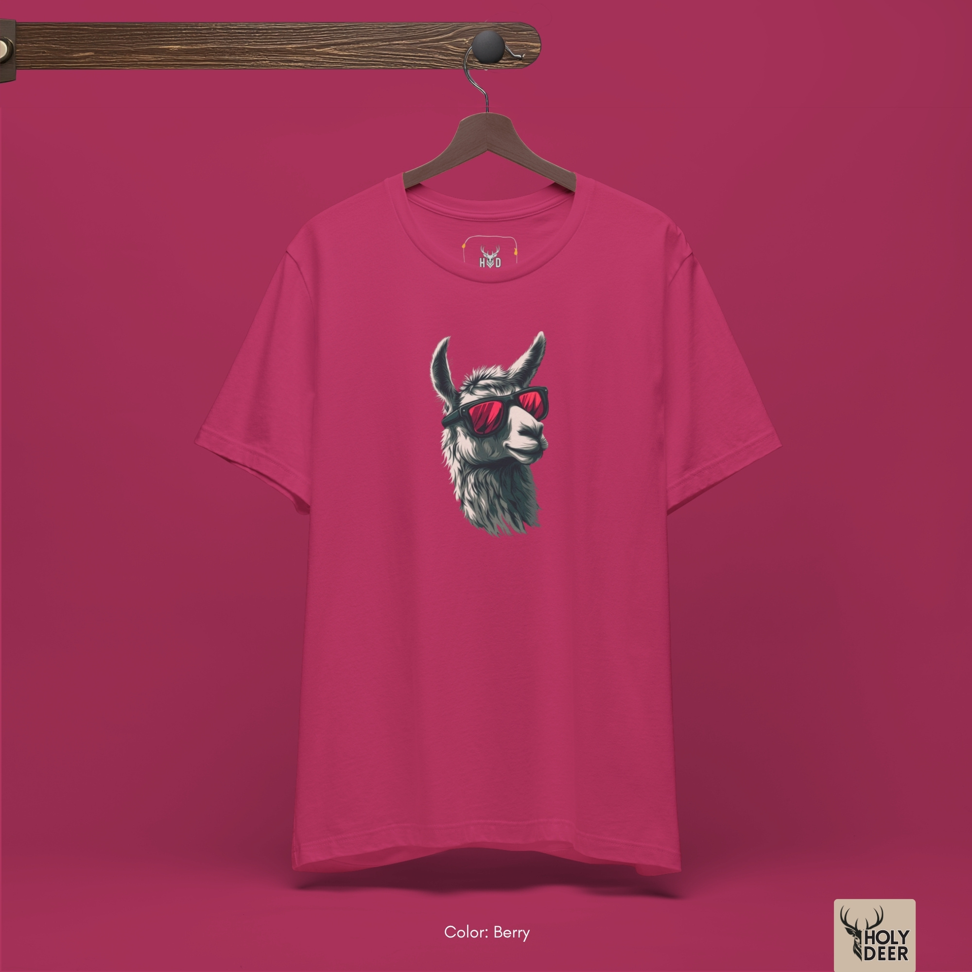 The iconic Cool Llama Shirt hanging cleanly on a luxury wood hanger, highlighting the robust neckline structure, split asymmetric graphic flow, and the official holydeer.com retail tags.