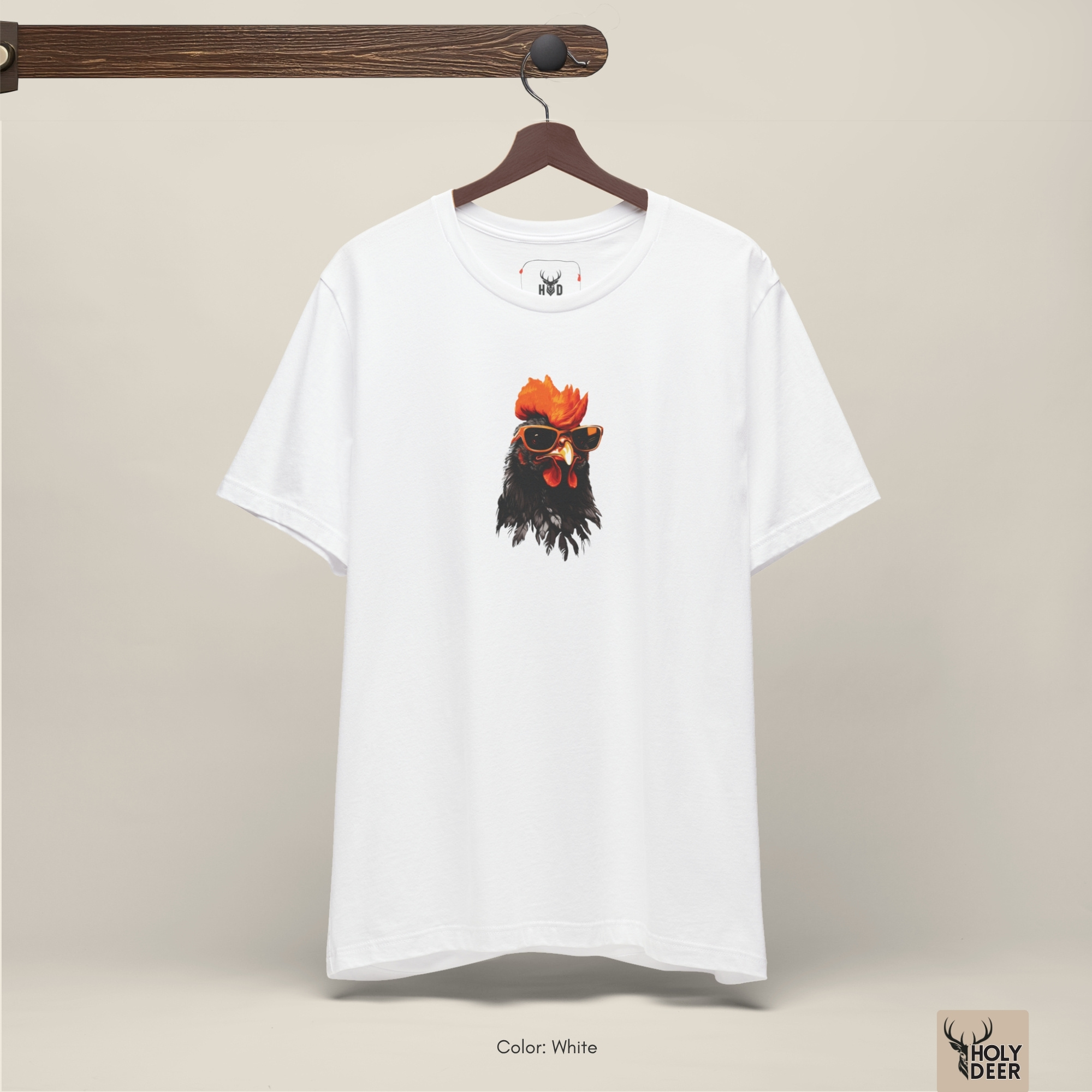 The iconic Cool Rooster Tee hanging cleanly on a luxury wood hanger, highlighting the robust neckline structure, rooster sunglasses graphic flow, and the official holydeer.com retail tags.
