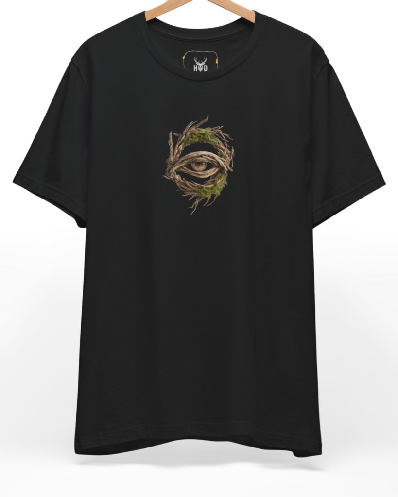 A high-end display of the official Holydeer Forest Eye Shirt showcasing unique Pagan Nature Top design lines. The central Surreal Eye Art graphic features a miniature Nature Eye Graphic layout centering a detailed Witchy Branch Shirt portrait with intricate green vine growths and tree root clothing textures printed squarely on a black shirt canvas.