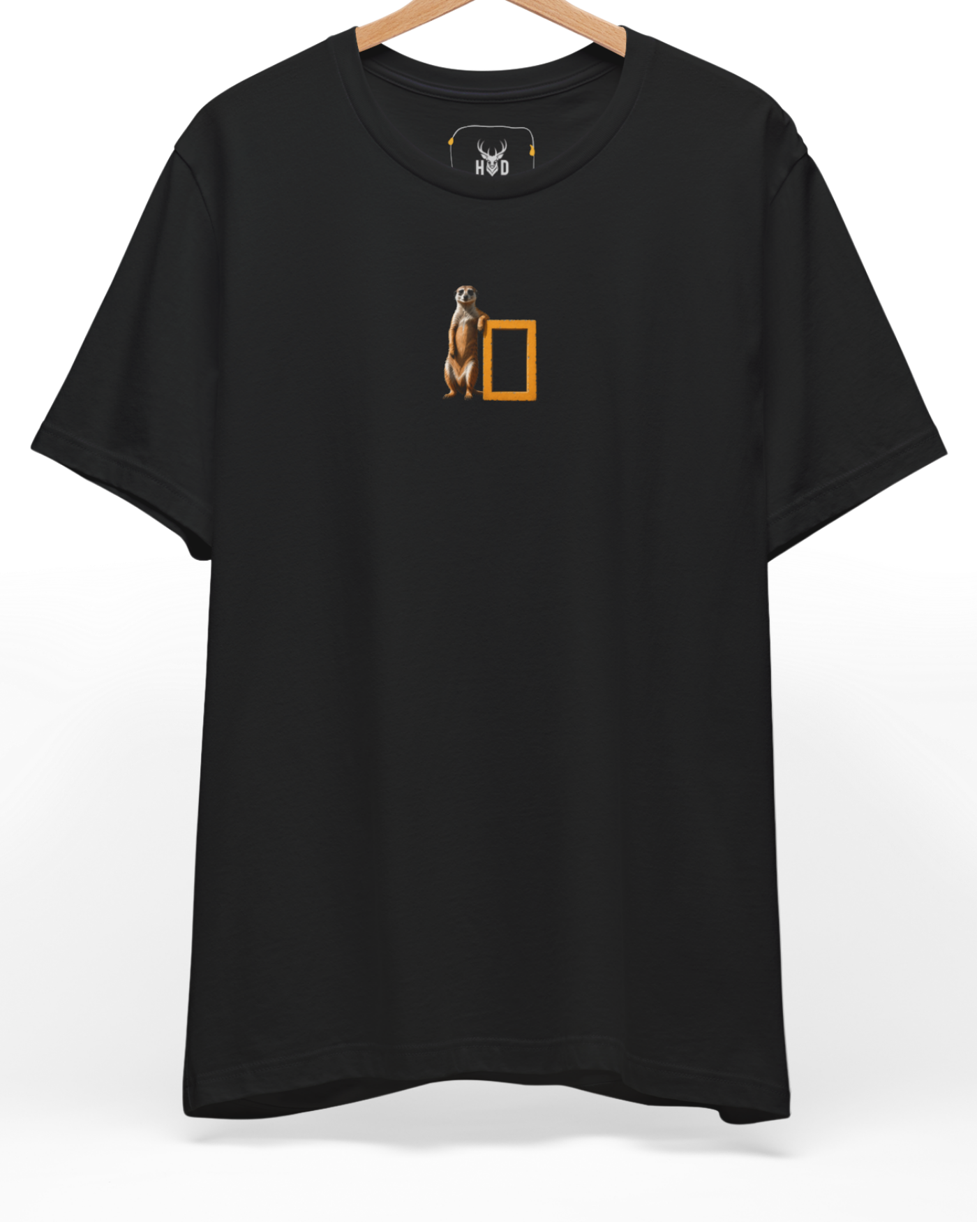 A high-end display of the official Holydeer Meerkat Graphic Tee showcasing unique Safari Aesthetic design lines. The central Cool Animal T-Shirt graphic features a miniature Geographic Parody layout centering a detailed Minimalist Meerkat leaning on a bright National Geographic Shirt style yellow frame printed squarely on a black shirt canvas.