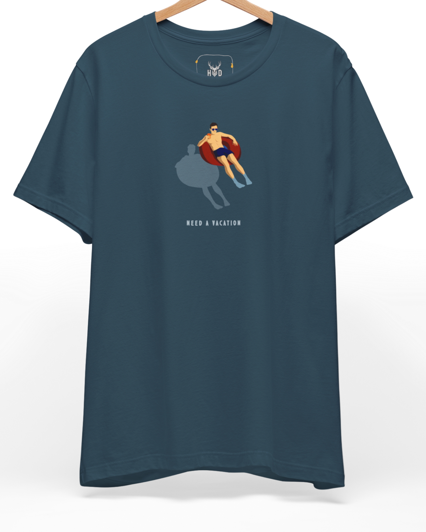 A high-end display of the official Holydeer Need a vacation garment showcasing unique Beach Life Apparel design lines. The central Tubing Man Shirt graphic features a miniature Minimalist Pool Top layout centering a detailed surreal water shirt guy figure with a red floaties art posture casting a dark shadow printed squarely on a premium deep teal shirt canvas.