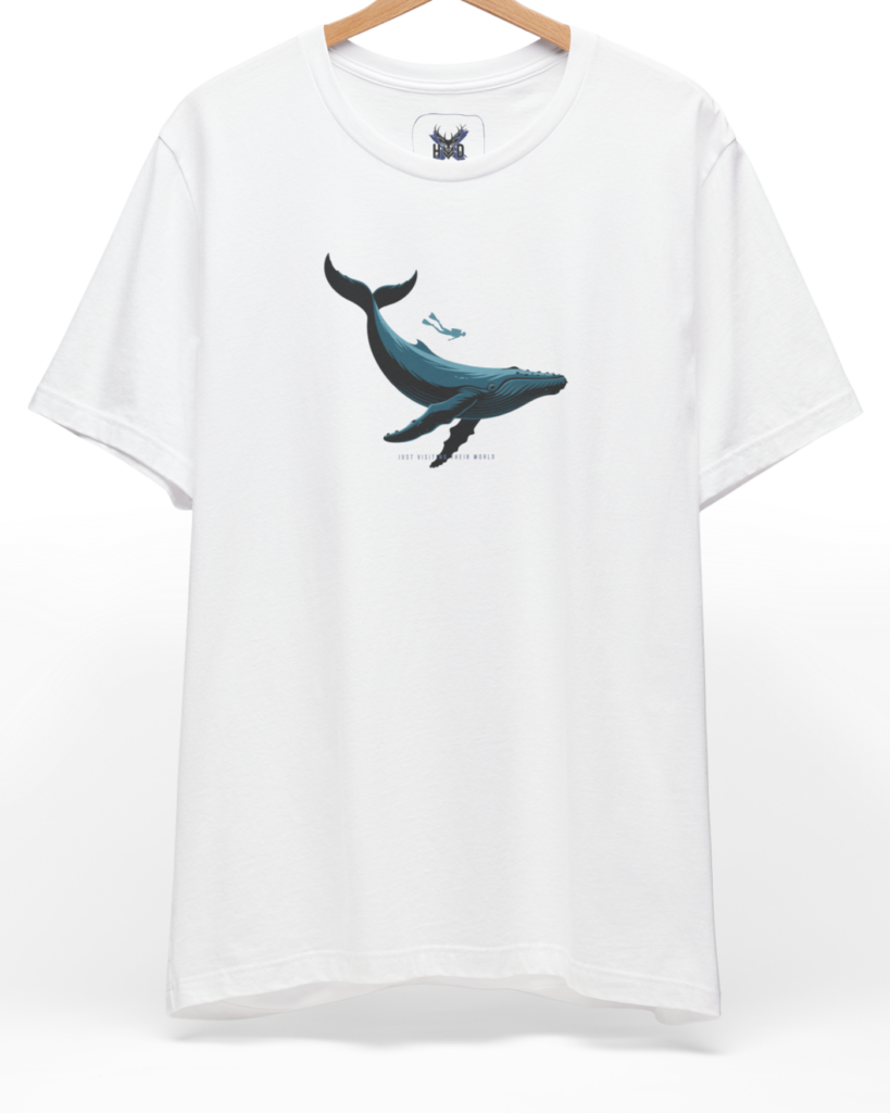 A pristine studio layout displaying the official Holydeer Scuba Diving Whale Shirt suspended from a modern chrome rack. The central artwork highlights a deep navy blue Whale Graphic Tee design swimming alongside a miniature Scuba Diving Shirt diver, creating a premium minimalist look on a white cotton canvas.