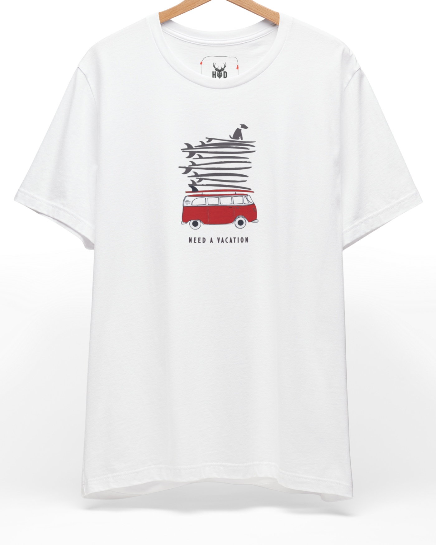 A high-end display of the official Holydeer Vacation Graphic Tee showcasing unique Ocean Humor Apparel design lines. The central Need A Vacation Top graphic features a miniature Nautical Streetwear layout centering a detailed red retro camper top carrying a giant vertical stack of sketchy surfboard elements with a surfing dog clothing icon printed squarely on a clean white shirt canvas.