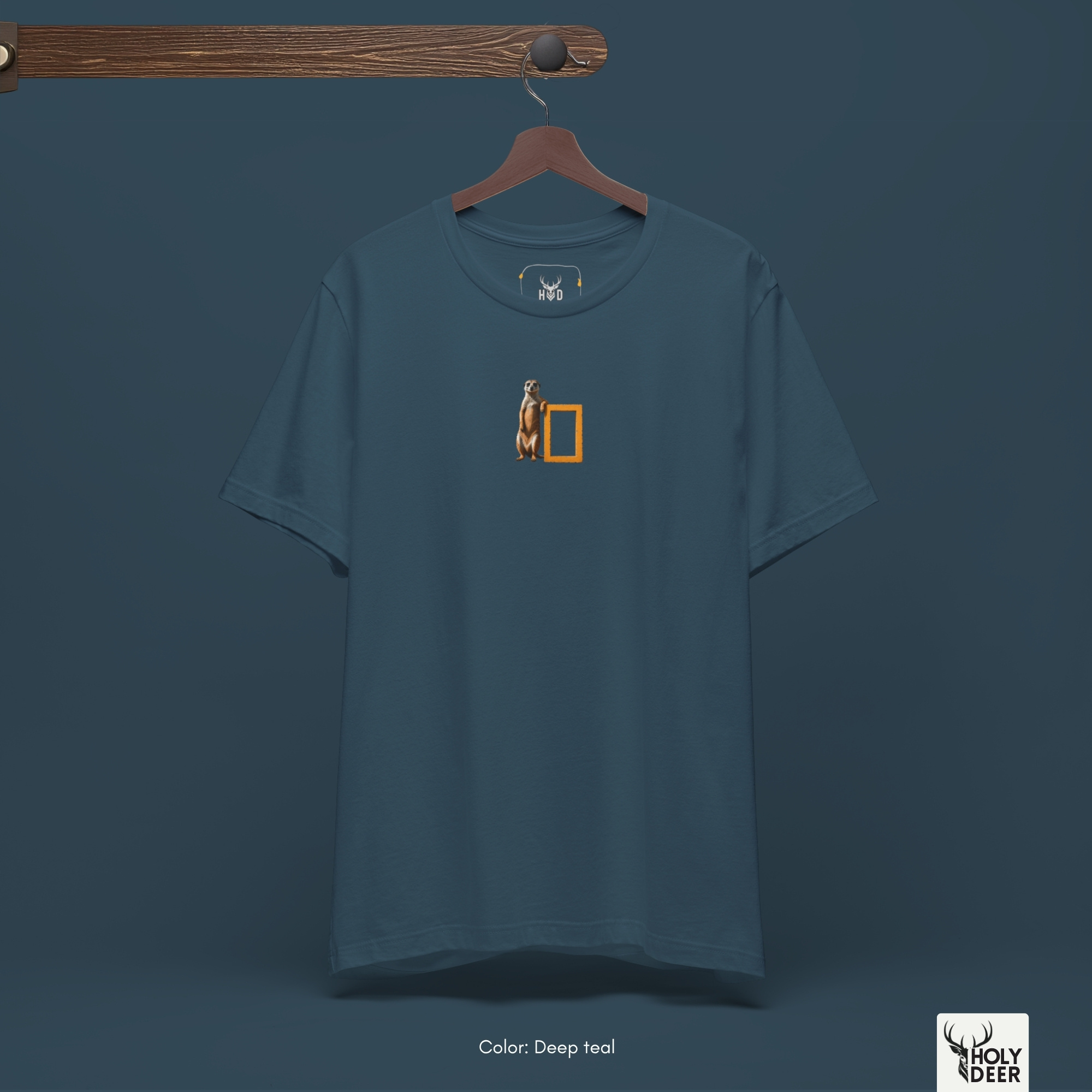 An extreme high-magnification macro focus inside the Holydeer Streetwear Meerkat Graphic Tee tracking the detailed Documentary Lover animal vector. The print layer highlights the realistic sand fur gradient strokes, tiny alert dark eyes, erect sentinel posture, and clean ink borders that define this premium cool animal t-shirt piece.