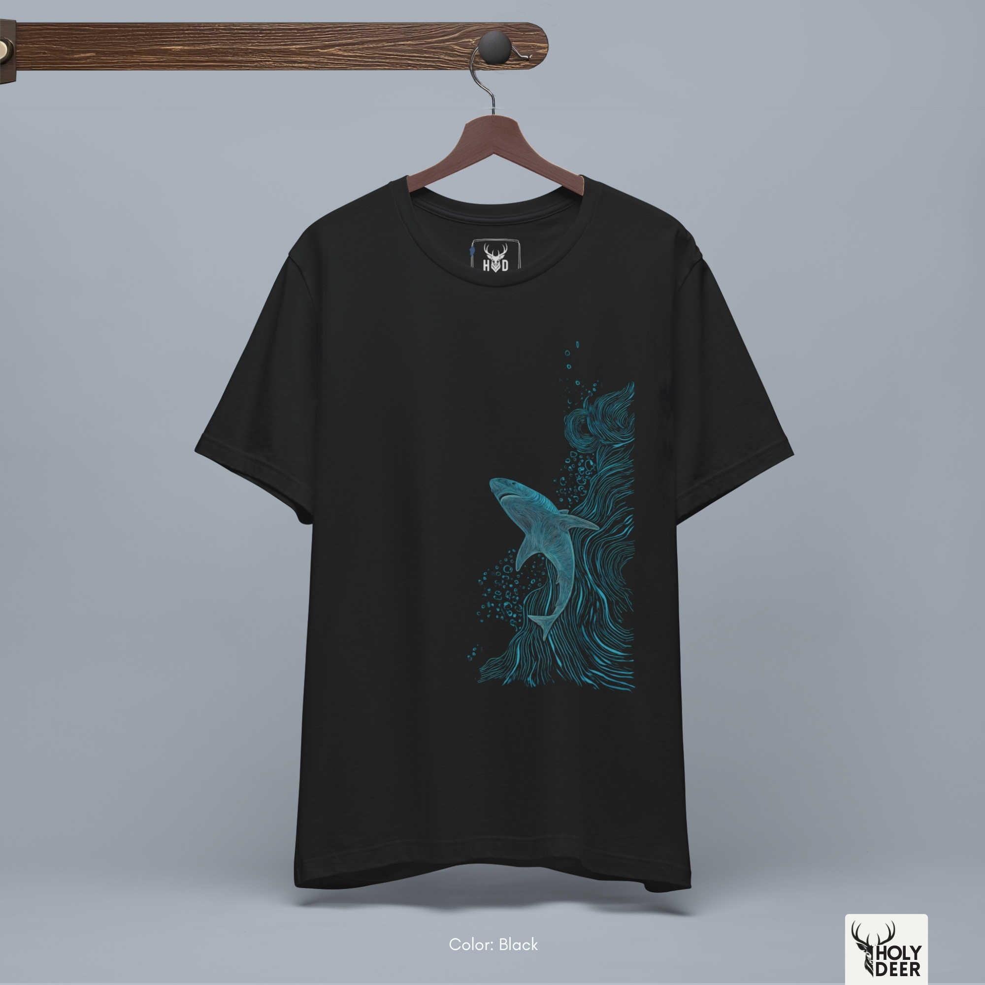 A close showroom catalog viewpoint of the Holydeer Apparel Shark Graphic Tee showing the specialized Sea Life Clothing printing finish. The framework tracks the tight screen registration of this Ocean Vortex Top and Shark Lover Gift selection to monitor deep design style rendering, material texturing behaviors, and light reflection.