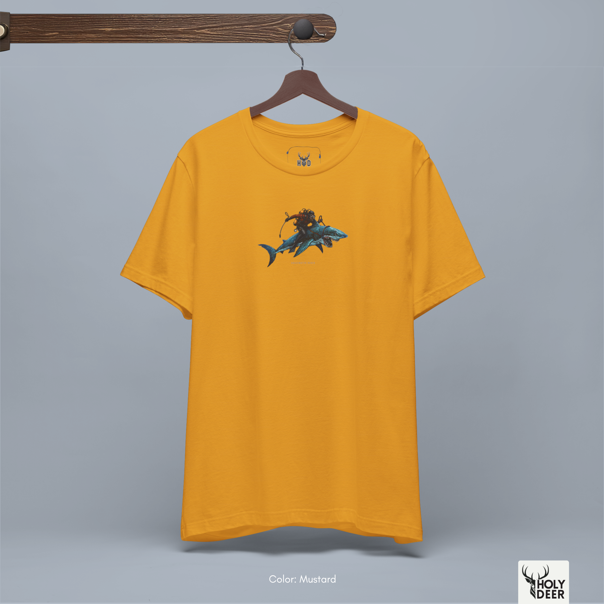A technical macro view of the Holydeer Tee Shark Graphic Tee capturing the tiny block typography reading underwater rodeo aligned perfectly beneath the shark graphic. The frame monitors the clean graphic structure to secure high nautical streetwear layout cohesion, creating a premium presentation for our signature diver gift shirt line.