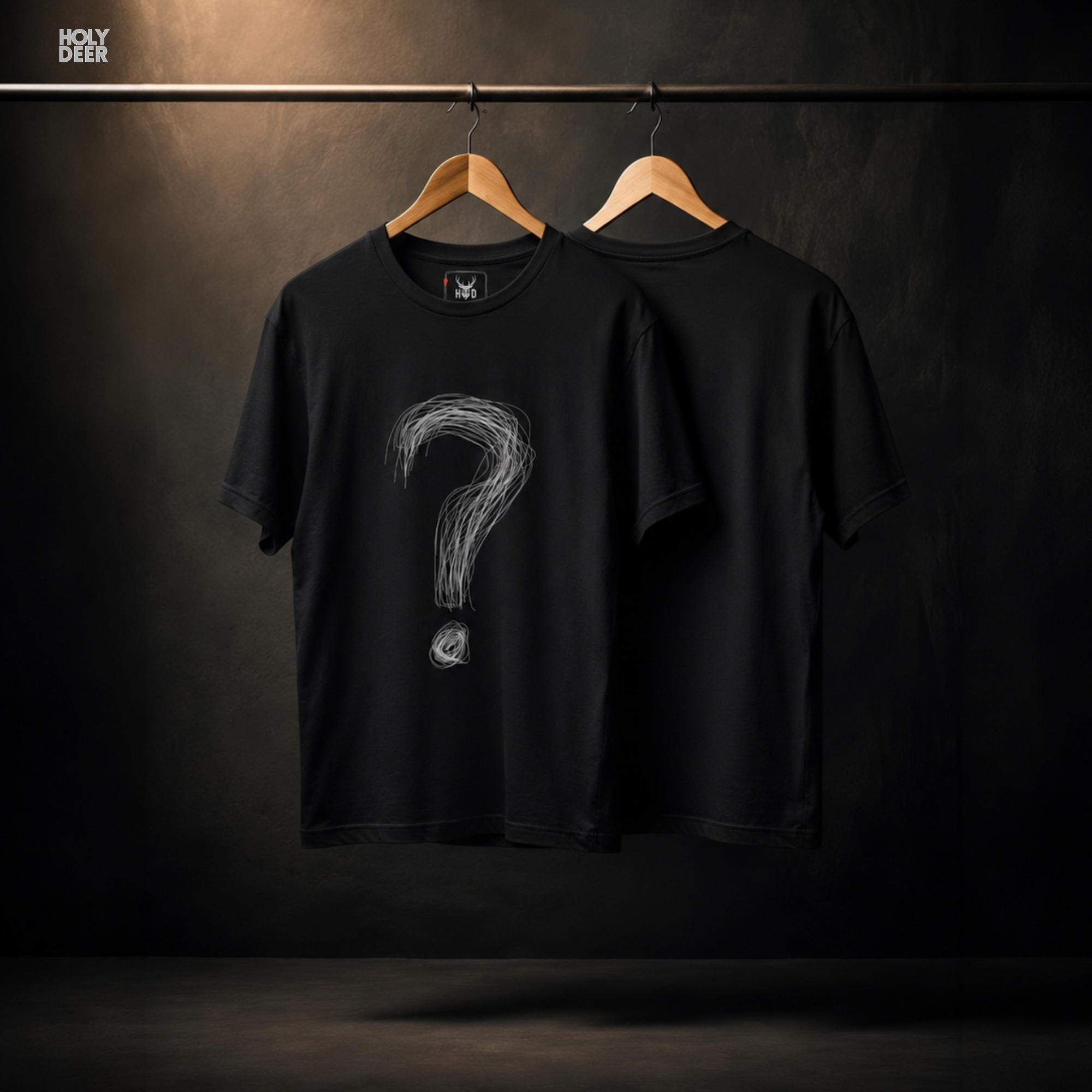 A detailed macro inspection of the Holydeer Clothing Question Mark Tee focusing entirely on the circular tangled dot marking the bottom punctuation. This specific section tracks the dense white screen ink layers, chaotic circular loop paths, and sharp outer boundary tracks forming the lower accent of the sarcastic graphic symbol.