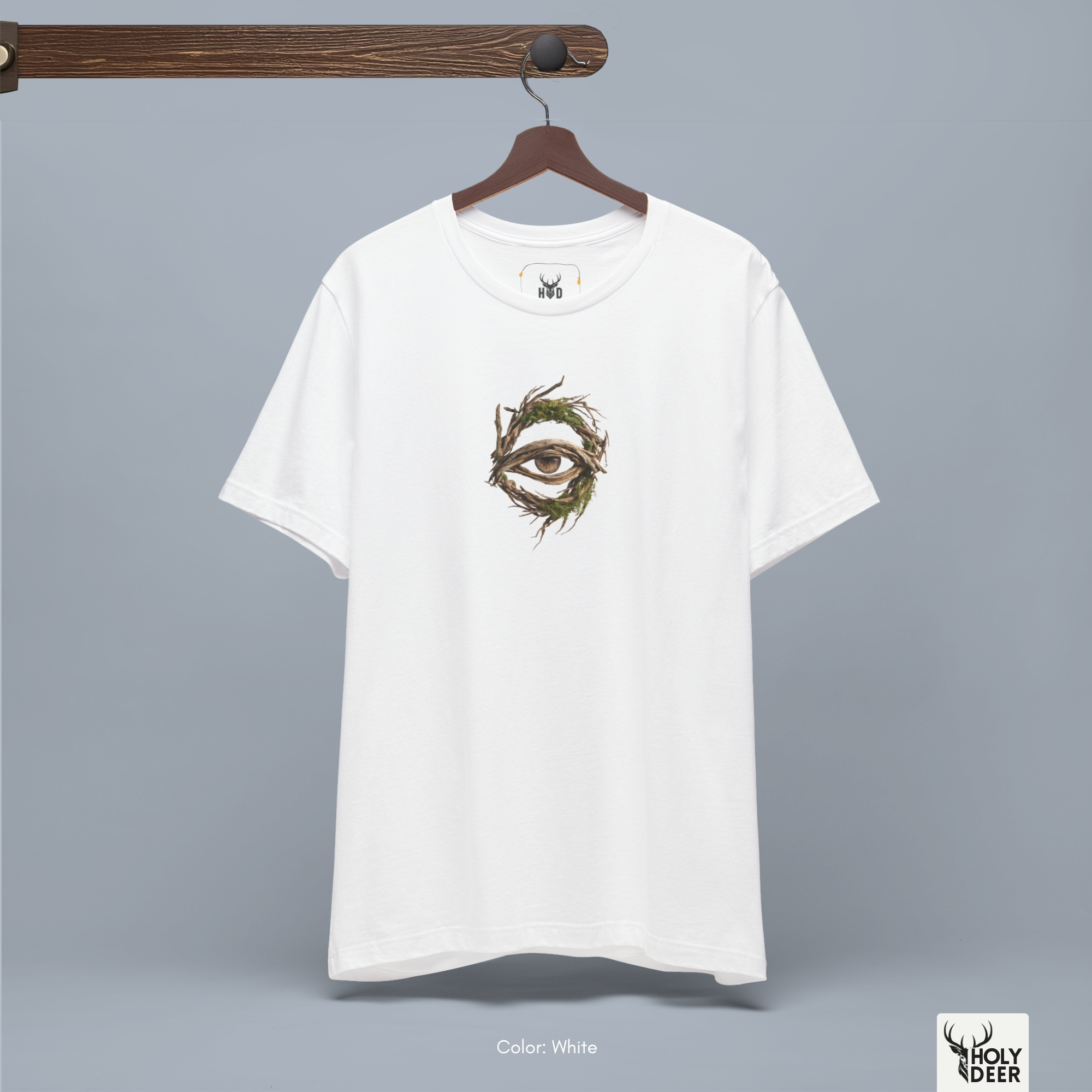 A detailed macro inspection of the Holydeer Clothing Forest Eye Shirt focusing entirely on the realistic occult center pupil and iris. This specific section tracks the delicate desaturated iris lines, organic symmetry circles, shadow depths around the eyelid branches, and dense ink layering forming the core of the tree root clothing symbol.
