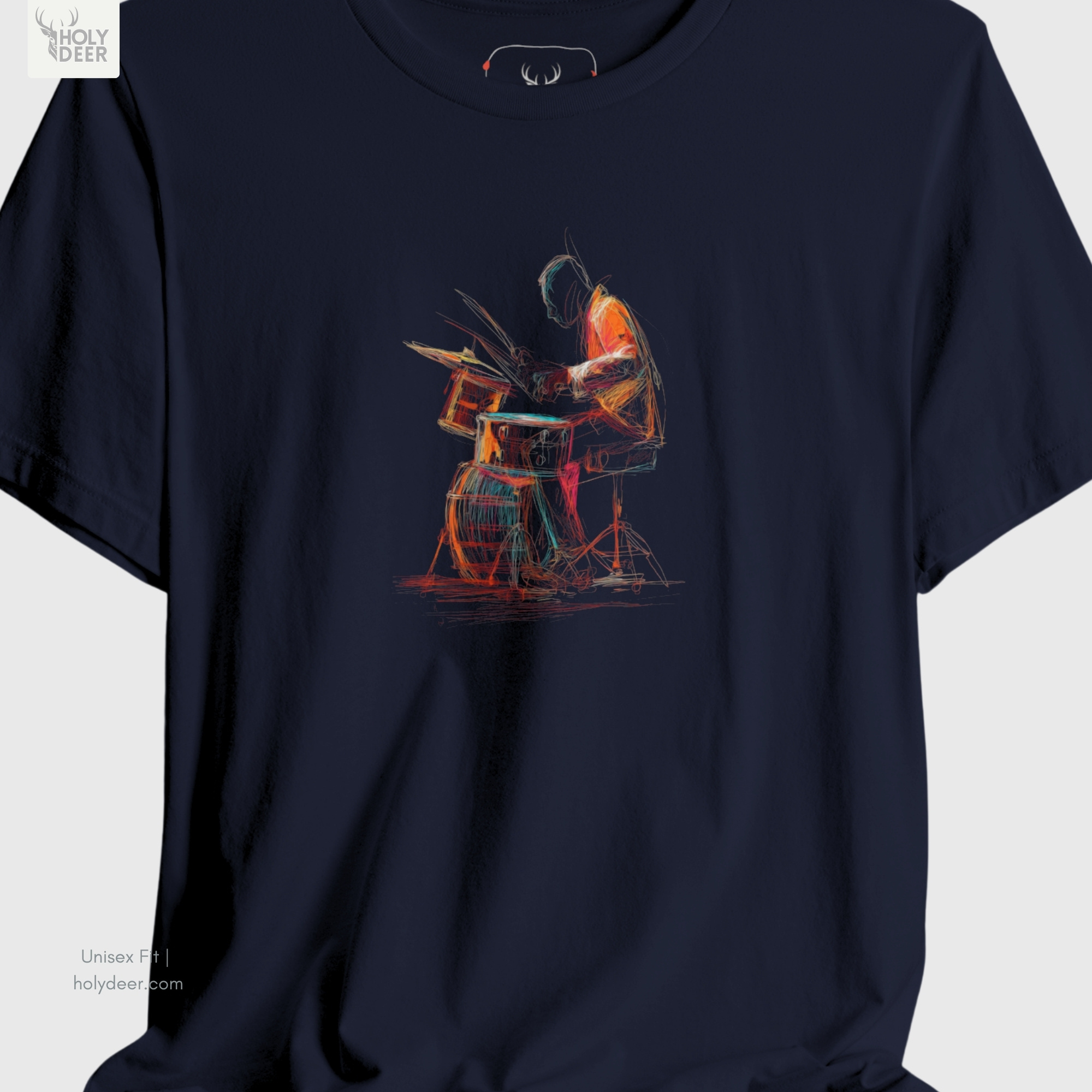 A detailed macro inspection of the Holydeer Clothing Drummer Graphic Tee focusing entirely on the rhythmic percussion instruments. This specific section tracks the circular snare rims, multiple tom-tom layers, dense red bass drum base textures, and glowing neon paint streaks forming the core of the colorful drum tee symbol.