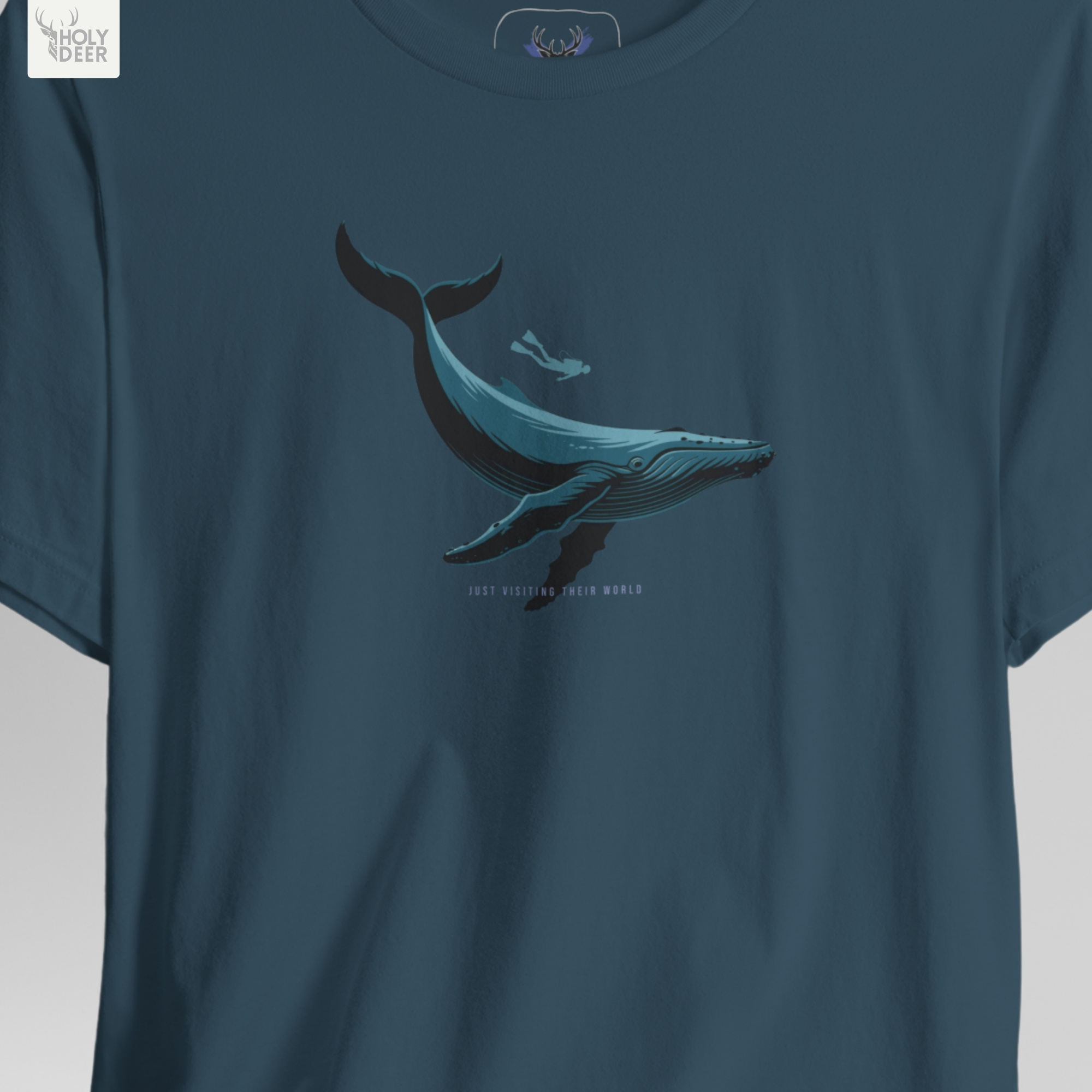 A precise technical macro focus inside the Holydeer Clothing Scuba Diving Whale Shirt isolating the floating undersea explorer graphic. The lens tracks the fine limbs, microscopic scuba mask outline, and clean flipper tracks that make this an ideal marine biology gift option.