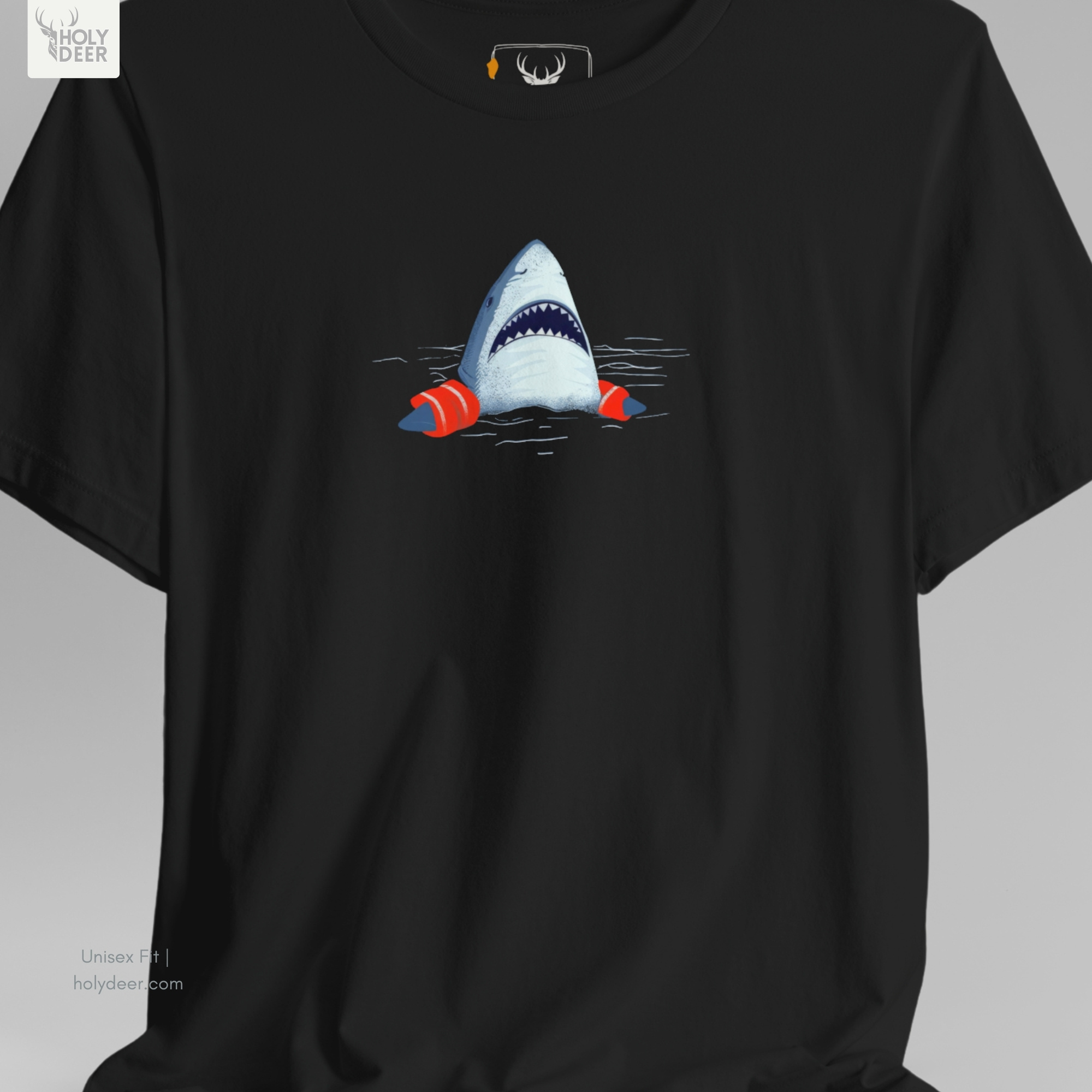A technical macro view of the Holydeer Tee Shark Graphic Tee capturing the pale blue surface water currents and scattered minimal wave marks. This area demonstrates how the subtle beach humor shirt particles and iconic ocean humor apparel elements create horizontal stability directly onto the dark teal background.