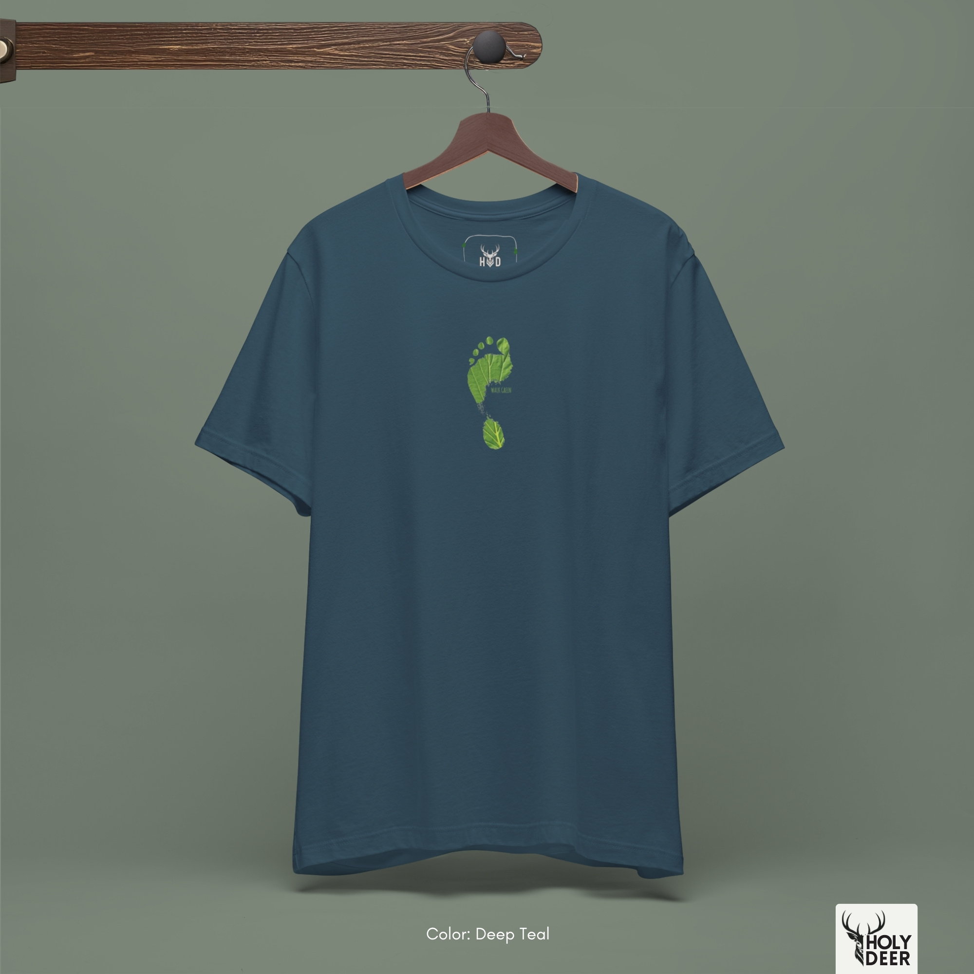 A technical macro view of the Holydeer Tee Walk Green Tee capturing the tiny block typography reading walk green aligned perfectly inside the leaf shape. The frame monitors the clean graphic structure to secure high sustainability top layout cohesion, creating a premium presentation for our signature eco activist shirt line.