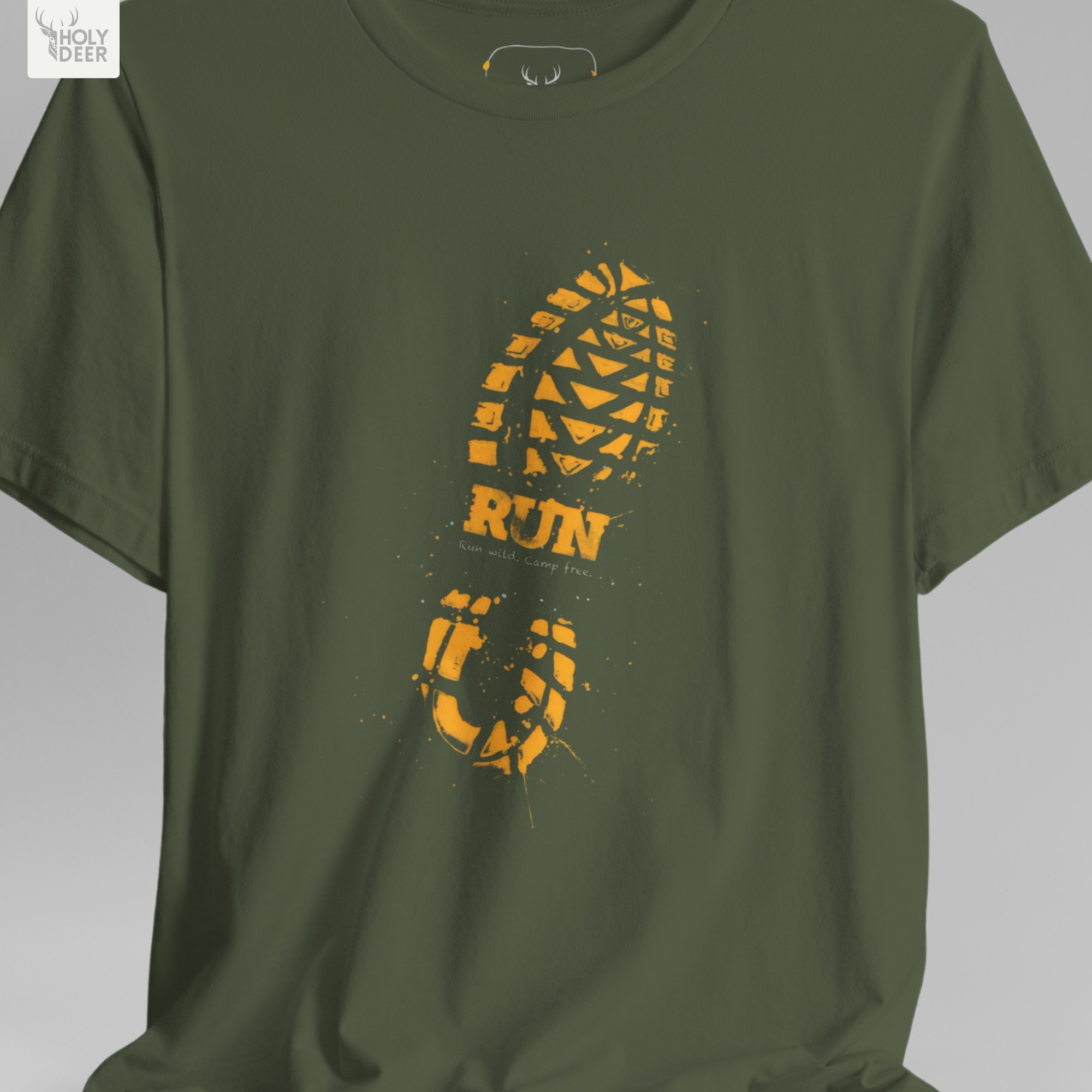 A commercial catalog layout tracking the Holydeer Clothing Trail Running Tee hanging cleanly from a custom timber stand. The product framework documents accurate wilderness track t material behavior, soft chest wrinkles, and balanced square casual fit parameters for high-end boutique distribution.