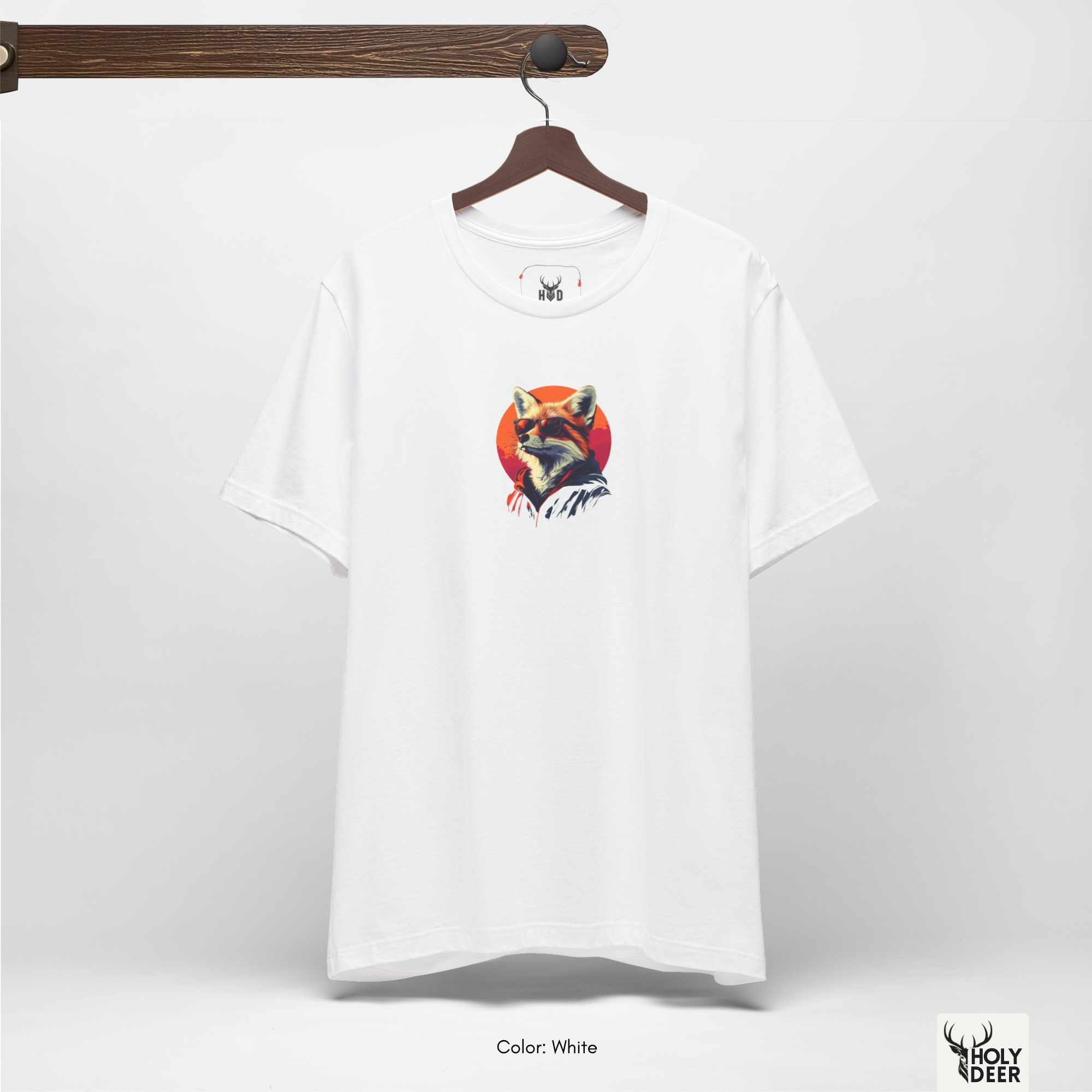 A commercial catalog layout tracking the Holydeer Clothing Cool Fox Graphic Tee hanging cleanly from a custom timber stand. The product framework documents accurate vaporwave apparel material behavior, soft chest wrinkles, and balanced square casual fit parameters for high-end boutique distribution.
