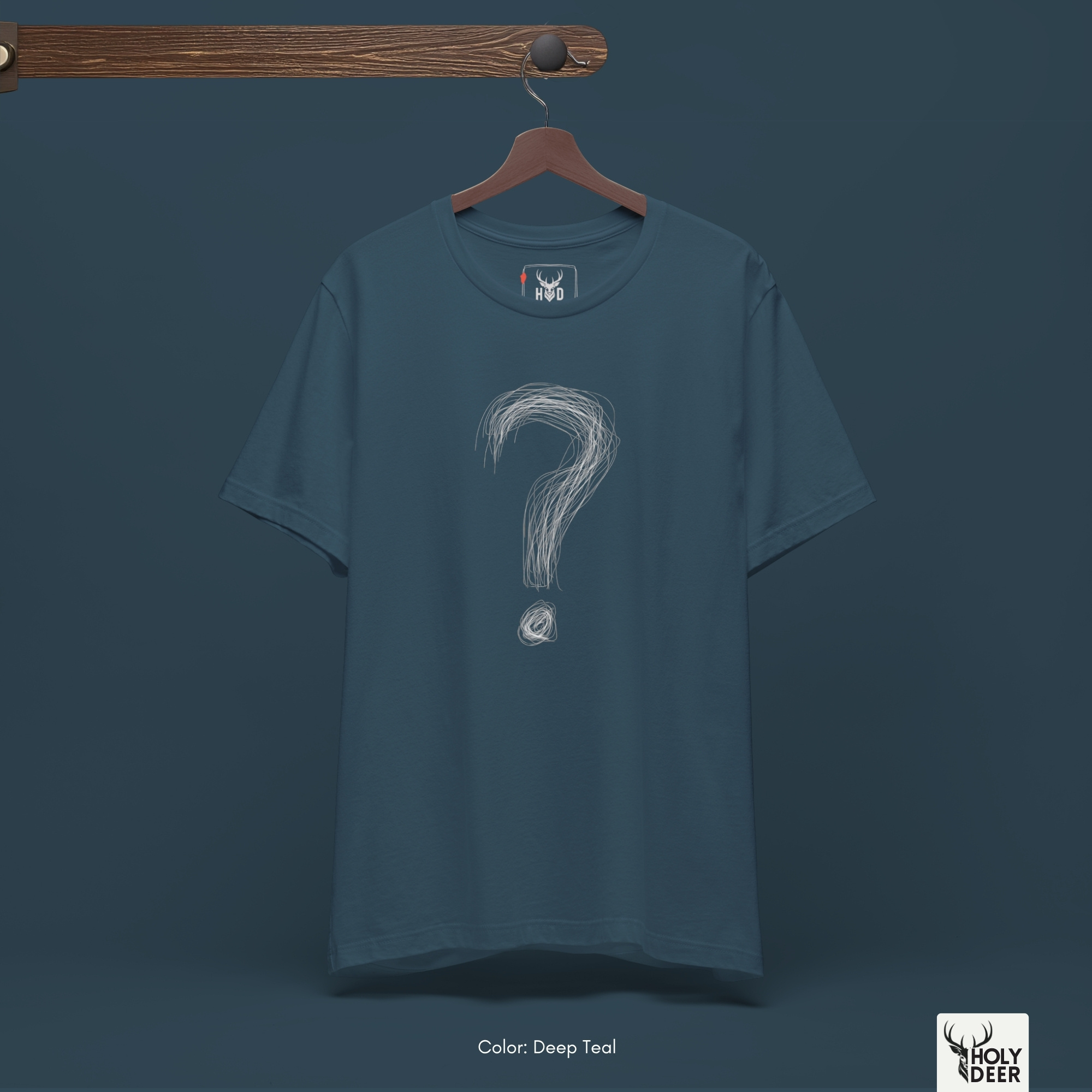 A commercial catalog layout tracking the Holydeer Clothing Question Mark Tee hanging cleanly from a custom timber stand. The product framework documents accurate scribble graphic top material behavior, soft chest wrinkles, and balanced square casual fit parameters for high-end boutique distribution.