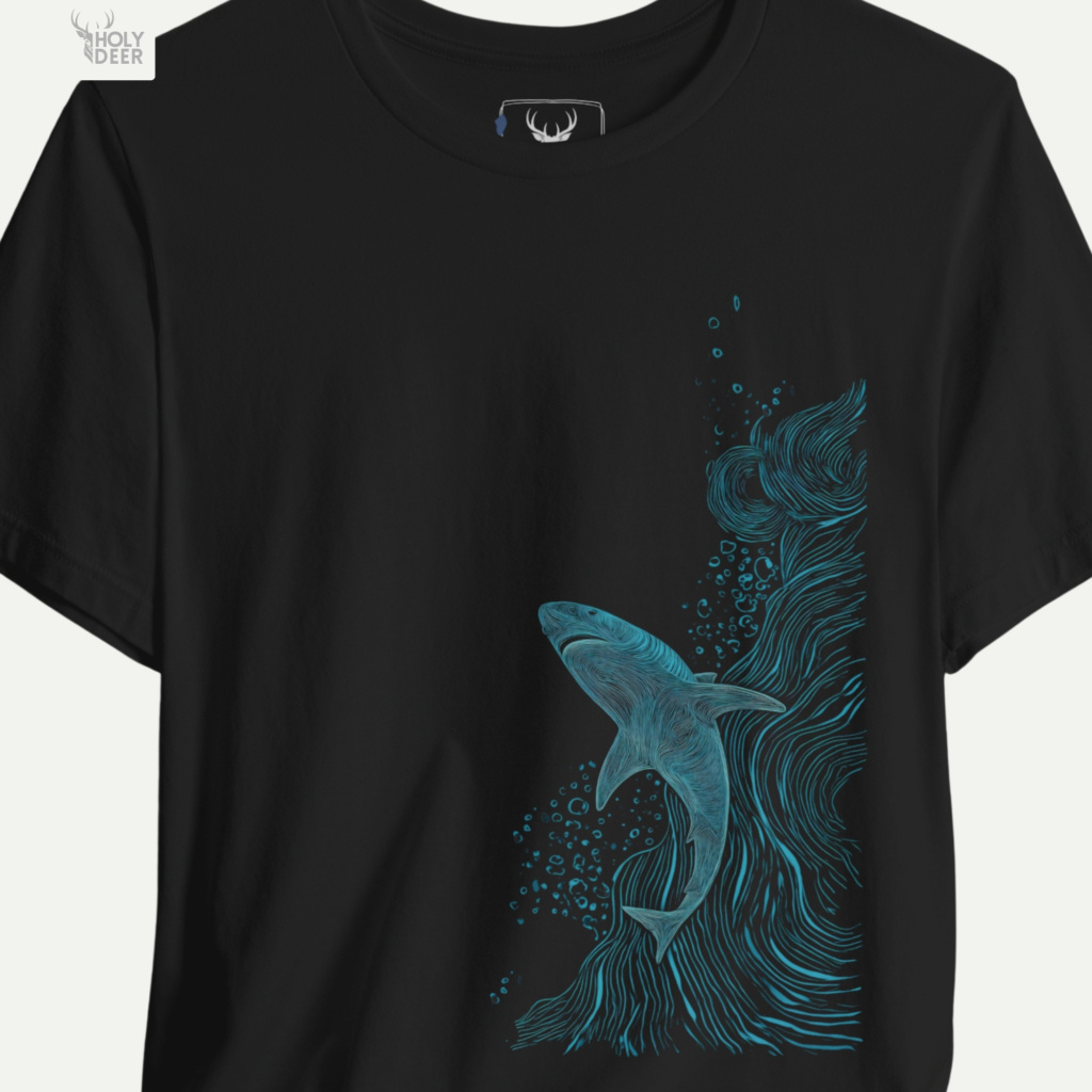A detailed macro inspection of the Holydeer Clothing Shark Graphic Tee focusing entirely on the circular tangled current tracks marking the right segment. This specific section tracks the dense blue screen ink layers, chaotic wave paths, and sharp outer boundary tracks forming the core of the nautical streetwear predator symbol.