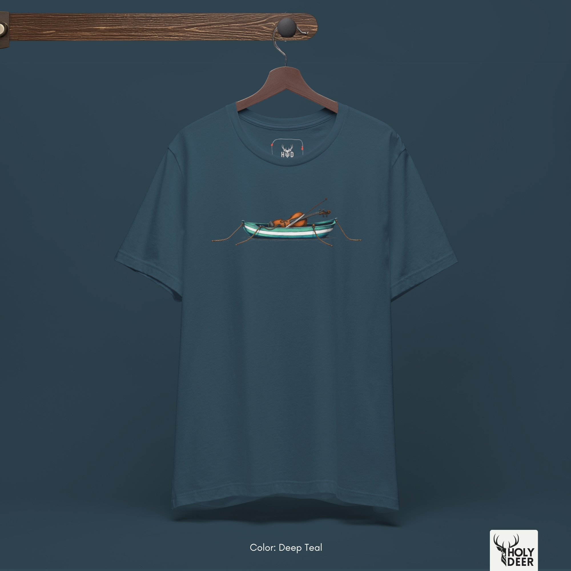 A detailed macro inspection tracking the parallel white and turquoise paint bands wrapping around the miniature wooden vessel structure. This specific panel highlights the dense ink saturation and fine shading drops that give three-dimensional depth to the melancholy ocean tee