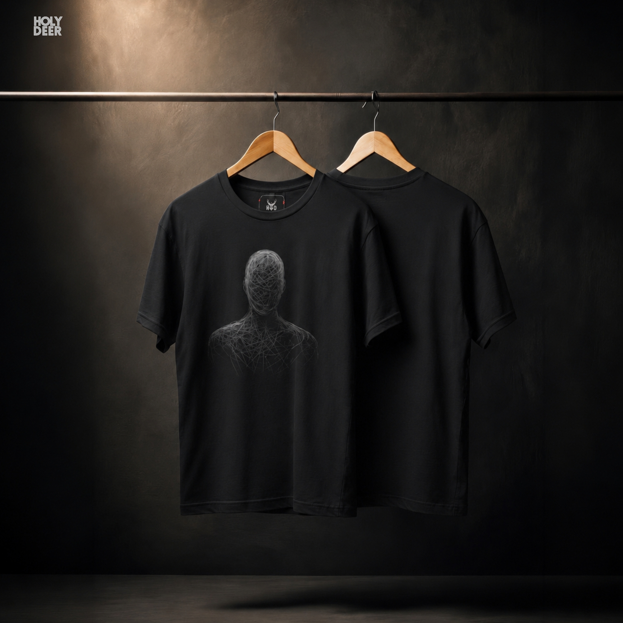A detailed macro inspection of the Holydeer Clothing Abstract Bust Tee focusing entirely on the chaotic line paths marking the chest and shoulder boundaries. This specific section tracks the dense white screen ink layers, overlapping curve paths, fading thread textures, and sharp outer boundary tracks forming the core of the psychological art symbol.