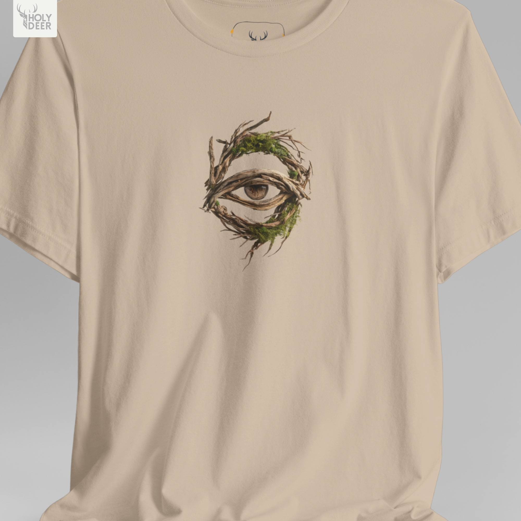 An abstract moody editorial lookbook grid manipulating deep fabric wrinkles and harsh side spotlight shadows on the Holydeer Streetwear Forest Eye Shirt. This high-contrast eerie nature t and nature eye graphic treatment demonstrates how the central brown and green mystic roots tee print maintains striking visual pop.