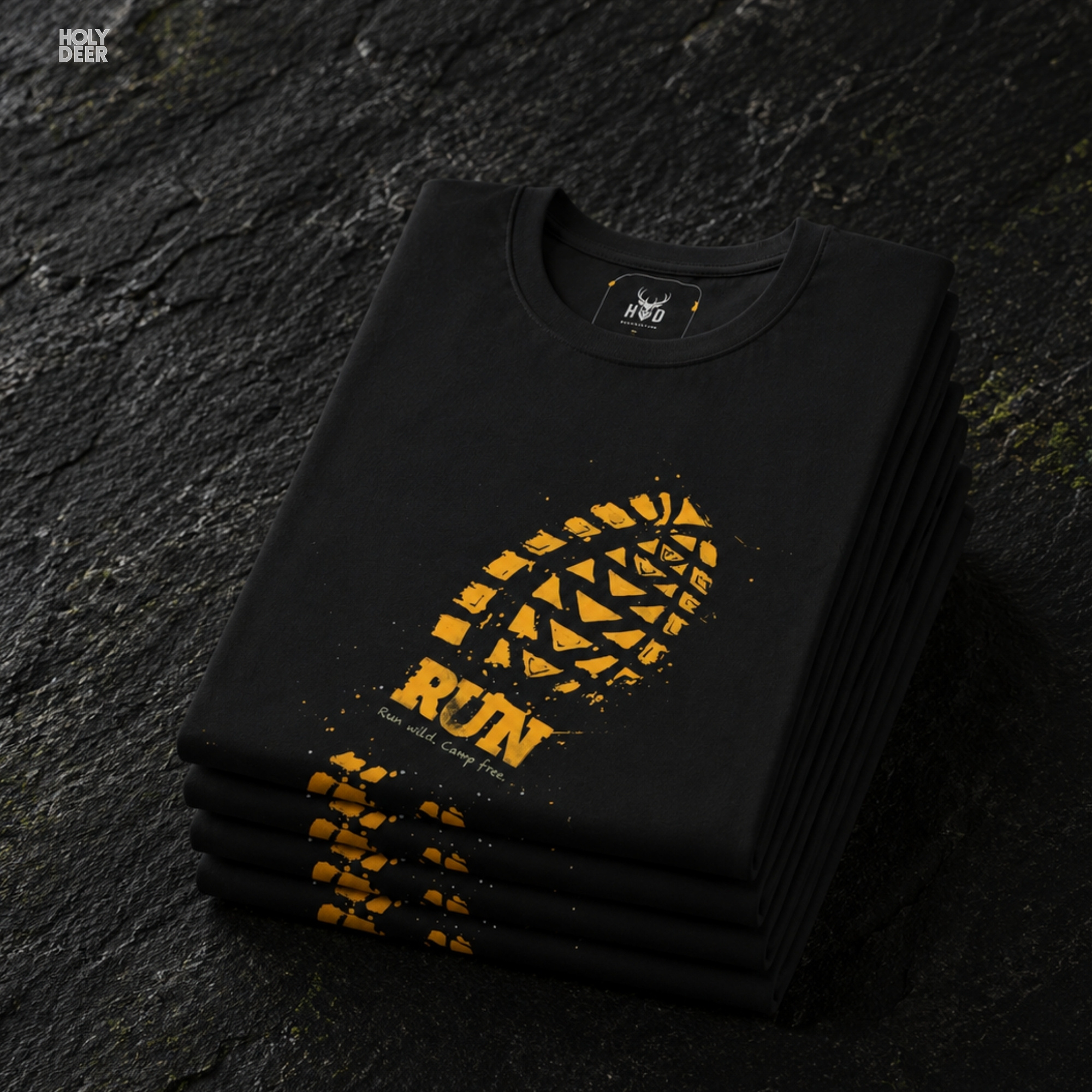 An extreme high-magnification macro focus inside the Holydeer Streetwear Trail Running Tee tracking the detailed Deep Design Style tread matrix. The print layer highlights the bright gold block sections, deep non-slip groove channels, distressed texture cracks, and clean ink borders that define this premium muddy footprint top piece.