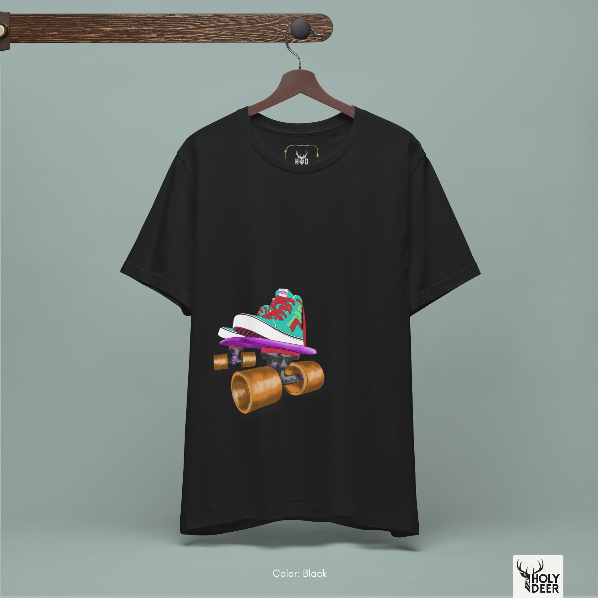 A commercial catalog presentation tracking the Holydeer Clothing Skater Graphic Tee hanging from a minimalist wooden display unit. This technical view lets buyers judge how the premium fabric responds to soft overhead studio lights, highlighting the natural drape and true-to-size casual silhouette.
